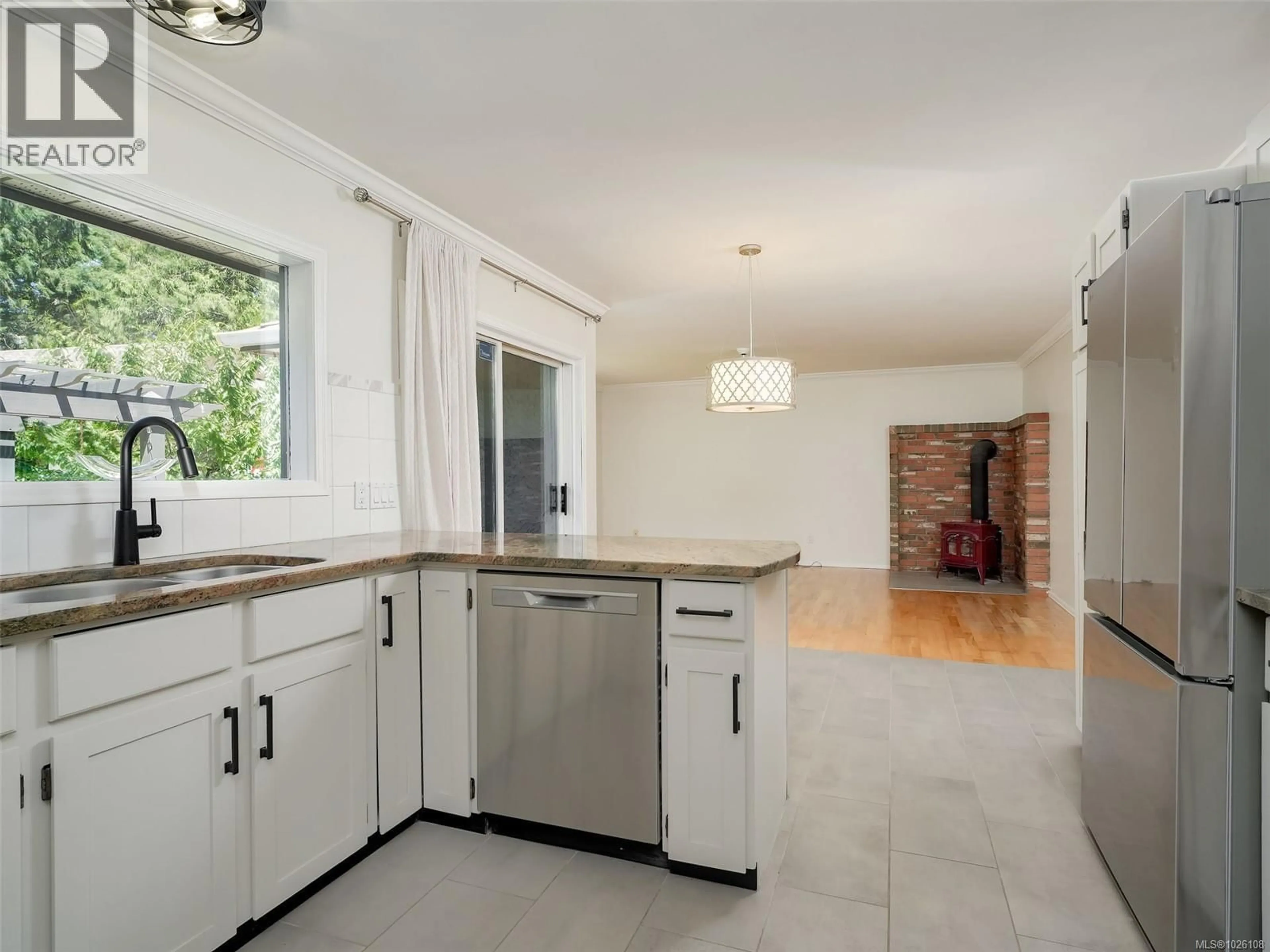 Open concept kitchen, ceramic/tile floor for 4860 EXCELSIOR ROAD, Saanich British Columbia V9E2E5