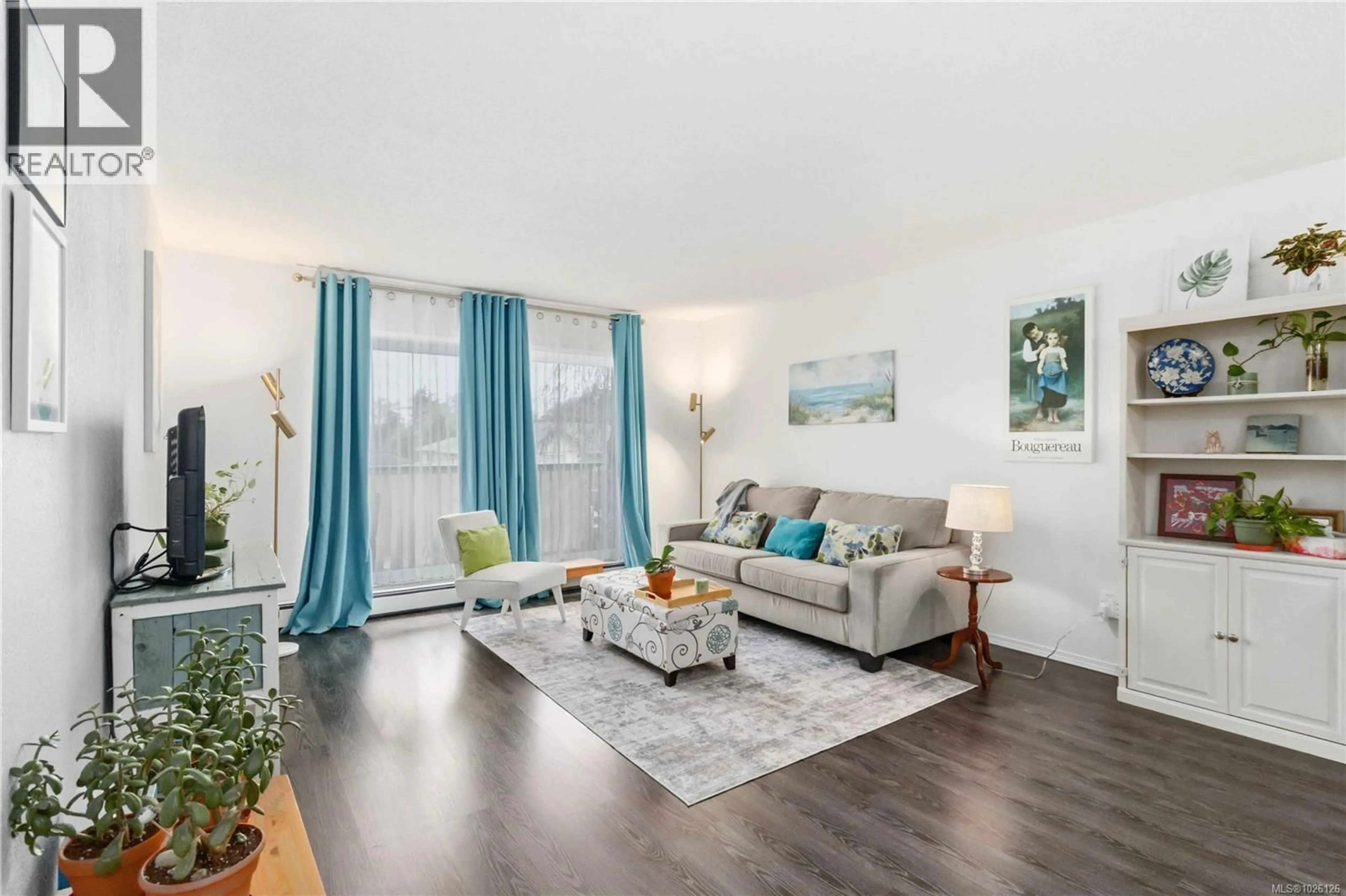 Living room with furniture, wood/laminate floor for 308 - 3225 ELDON PLACE, Saanich British Columbia V8Z6A7