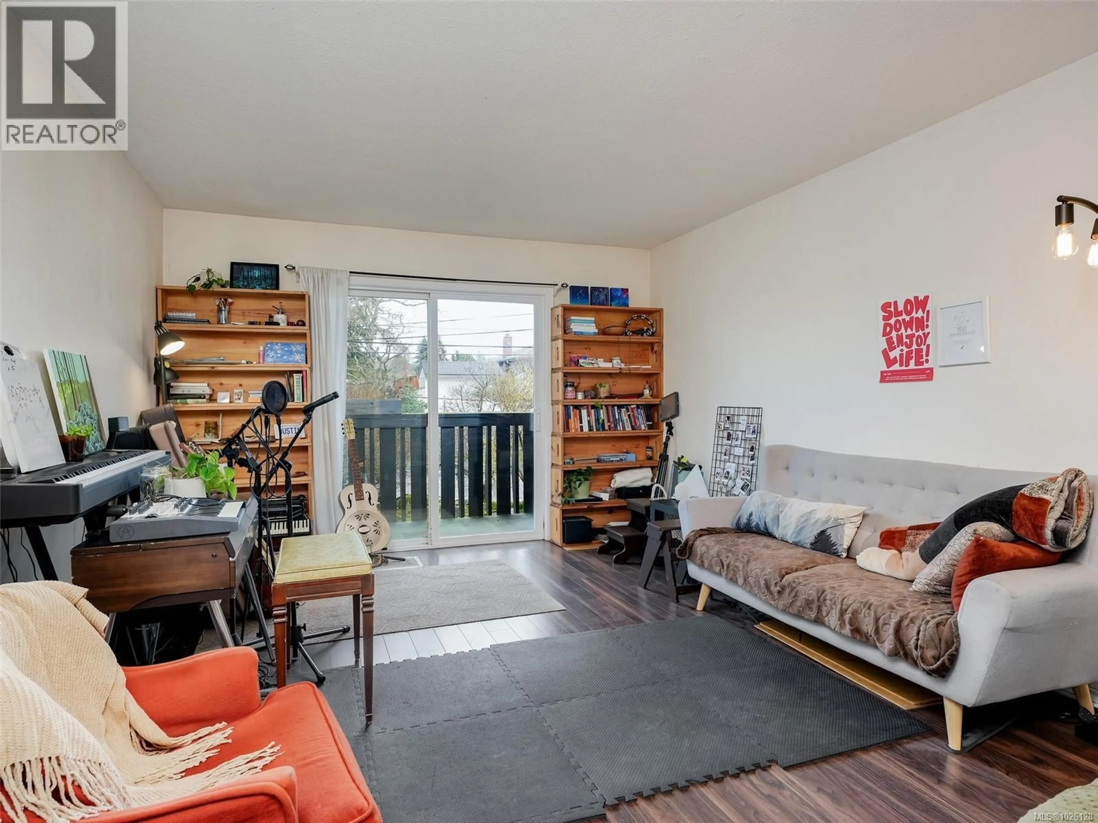 Living room with furniture, wood/laminate floor for 201 - 1215 BAY STREET, Victoria British Columbia V8T1S7