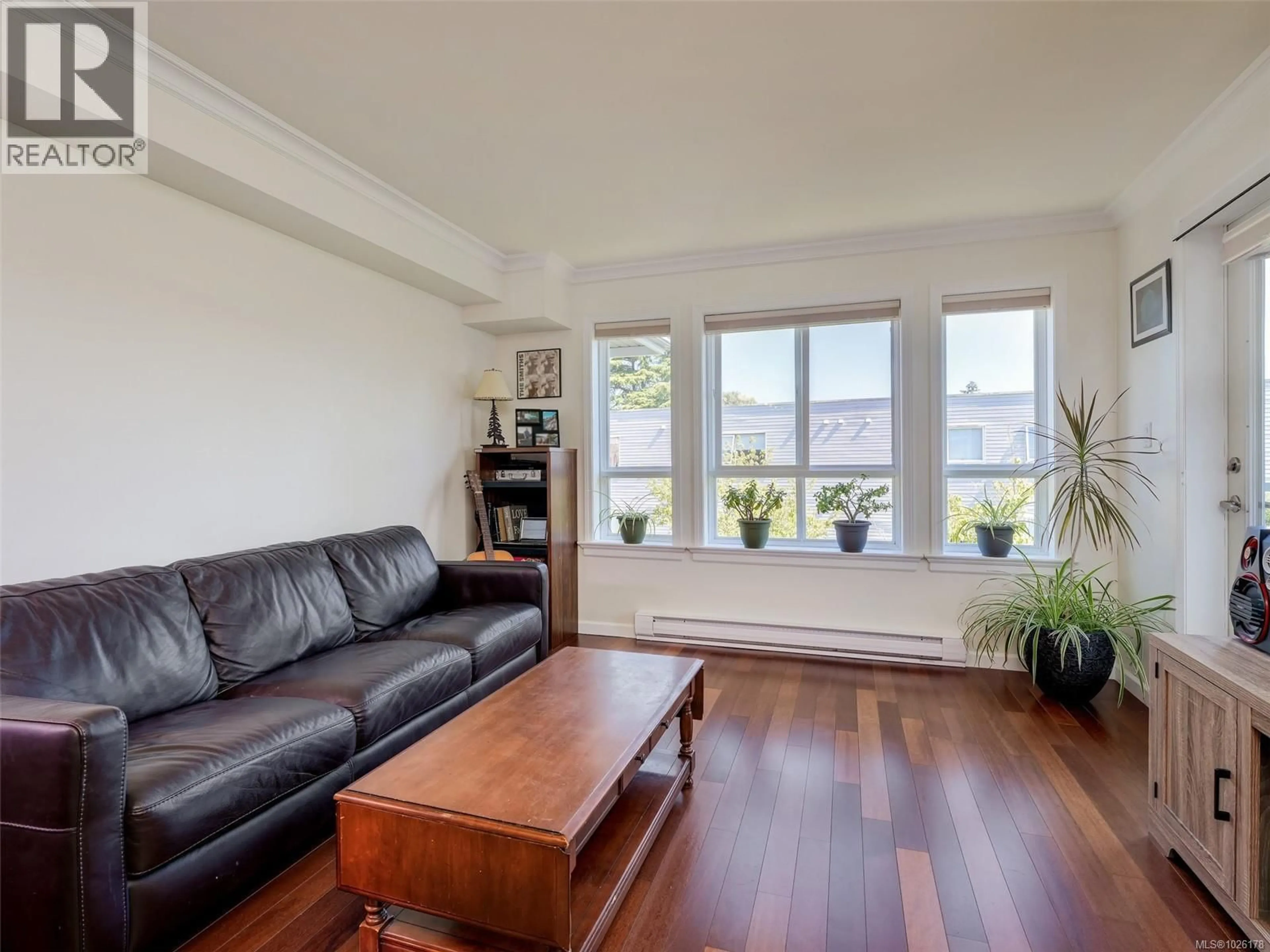 Living room with furniture, wood/laminate floor for 306 - 1514 CHURCH AVENUE, Saanich British Columbia V8P0A3