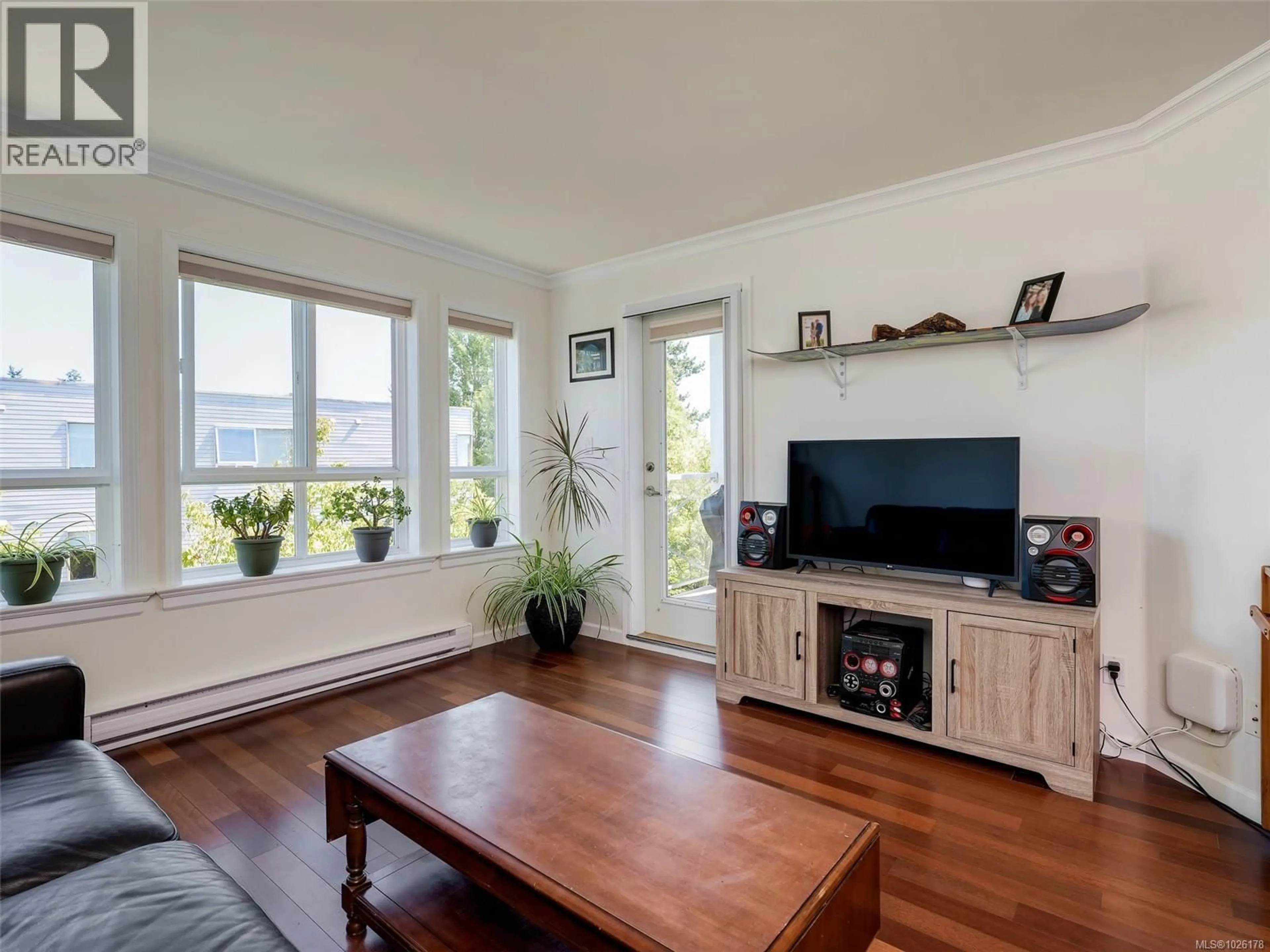 Living room with furniture, wood/laminate floor for 306 - 1514 CHURCH AVENUE, Saanich British Columbia V8P0A3