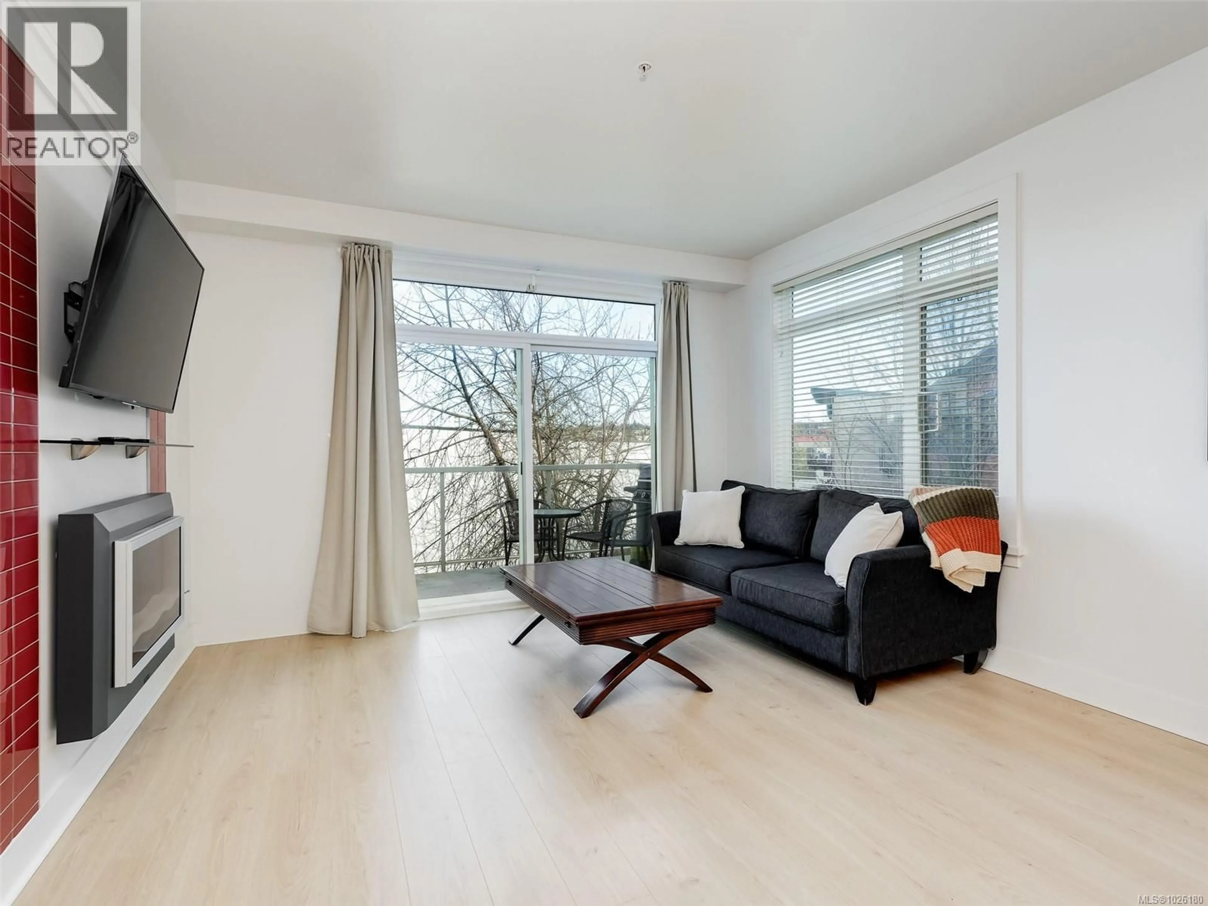 Living room with furniture, wood/laminate floor for 305 - 606 SPEED AVENUE, Victoria British Columbia V8Z1A4
