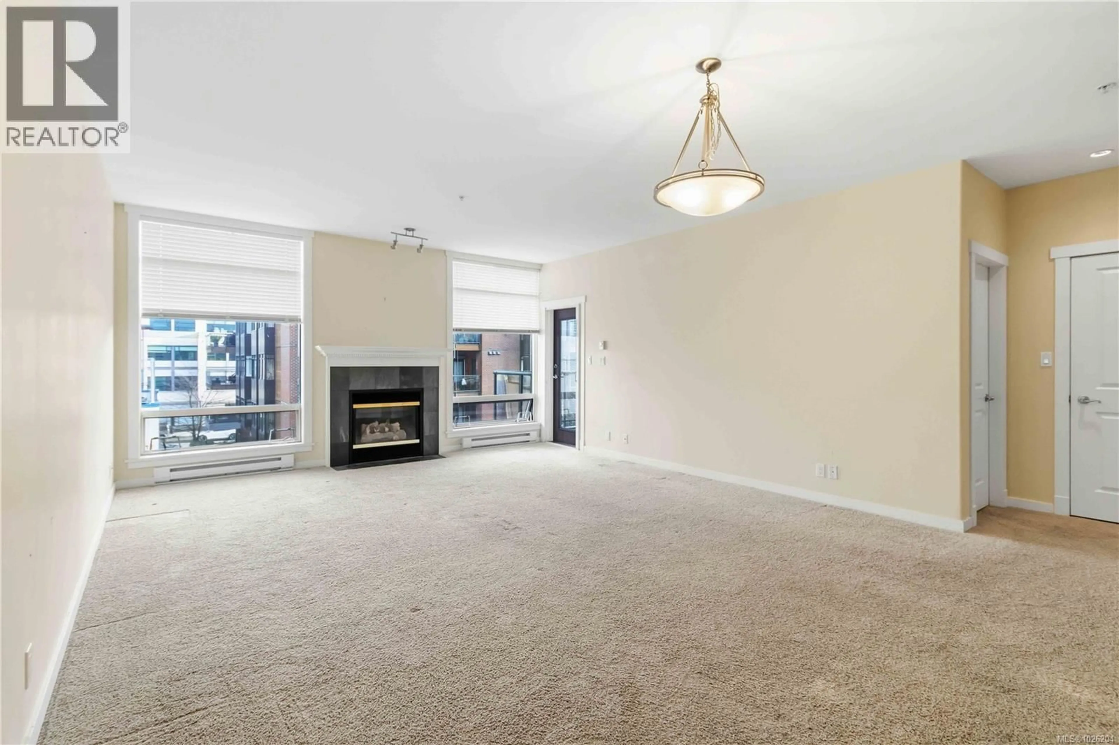 Living room with furniture, carpet floor for 306 - 330 WATERFRONT CRESCENT, Victoria British Columbia V8T5K3