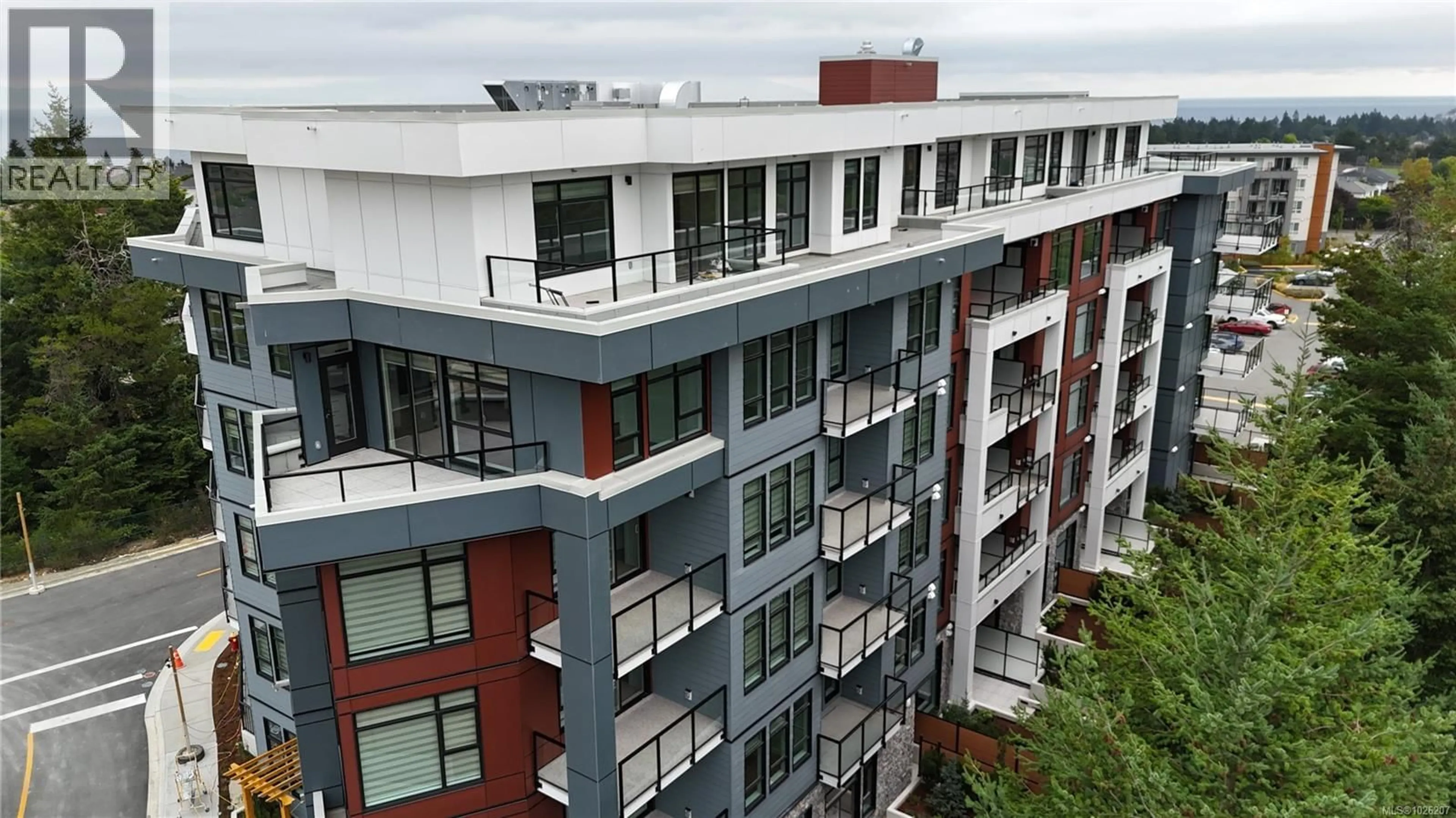 A pic from outside/outdoor area/front of a property/back of a property/a pic from drone, city buildings view from balcony for 505 - 6320 SENTINAL DRIVE, Nanaimo British Columbia V9V1W4