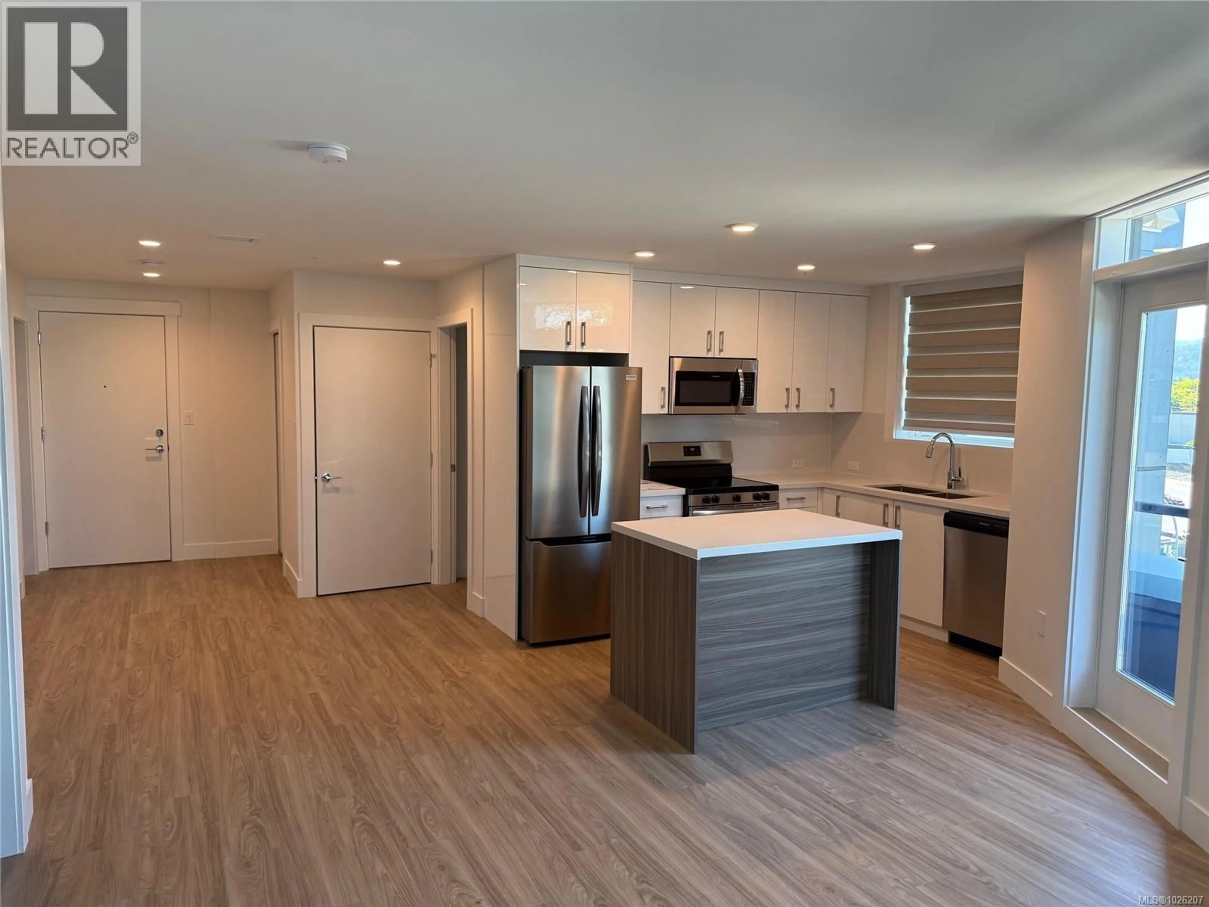Open concept kitchen, wood/laminate floor for 505 - 6320 SENTINAL DRIVE, Nanaimo British Columbia V9V1W4