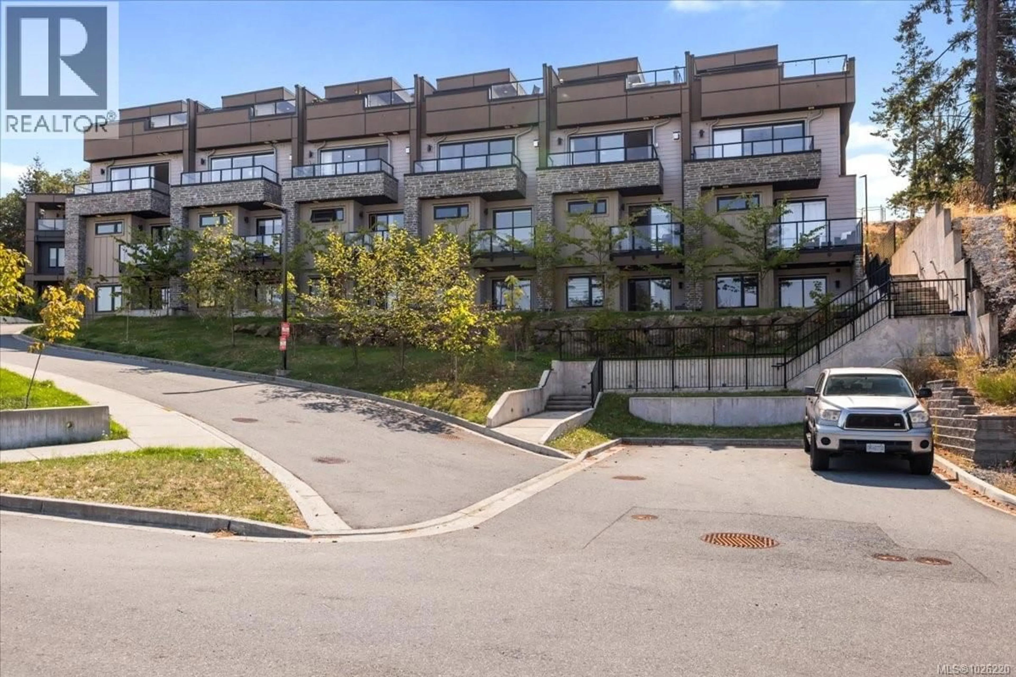 A pic from outside/outdoor area/front of a property/back of a property/a pic from drone, street for 102 - 5711 VANDERNEUK ROAD, Nanaimo British Columbia V9T5H3