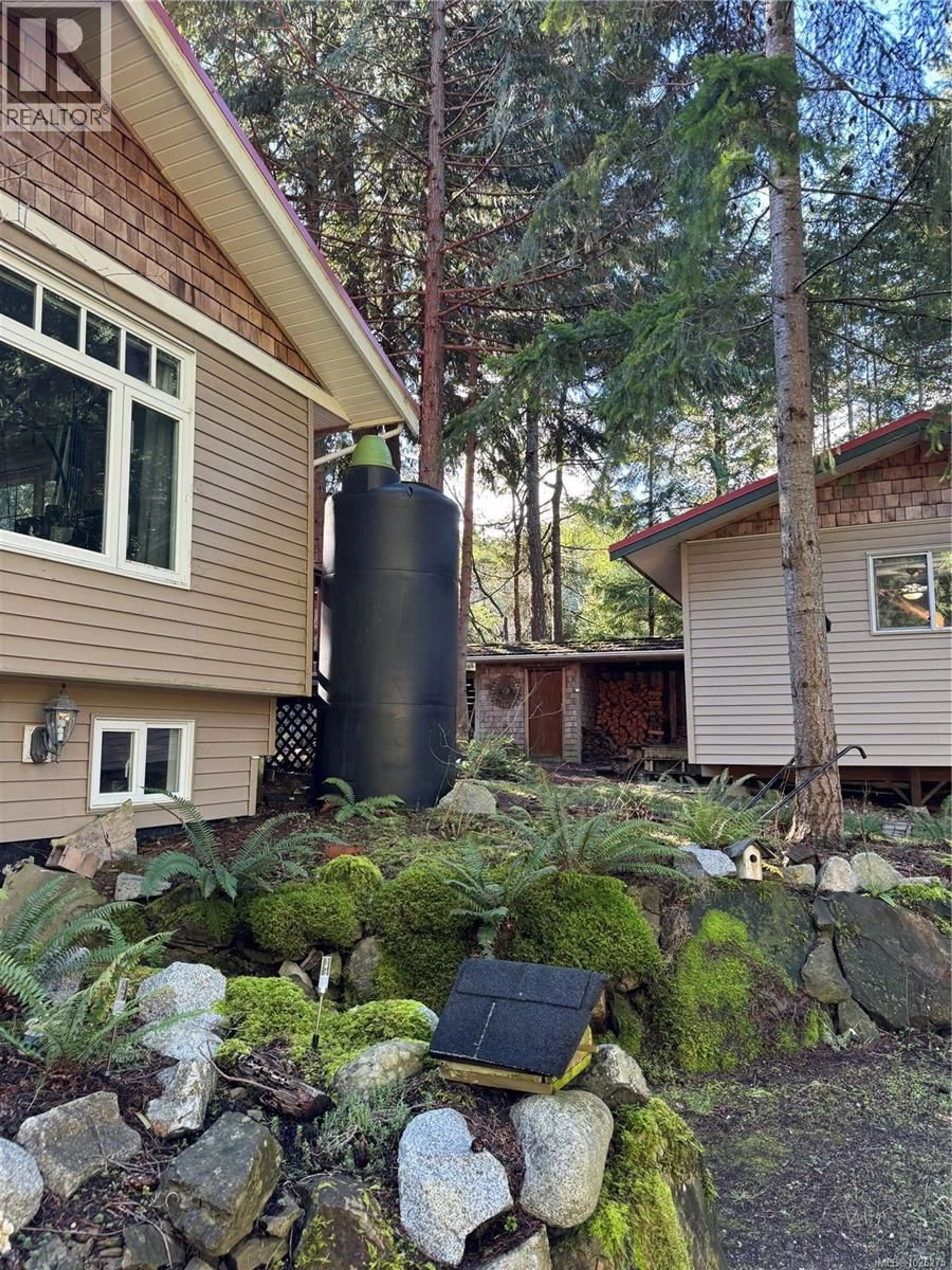 Home with vinyl exterior material, forest/trees view for 559 BLITZ ROAD, Mayne Island British Columbia V0N2J1
