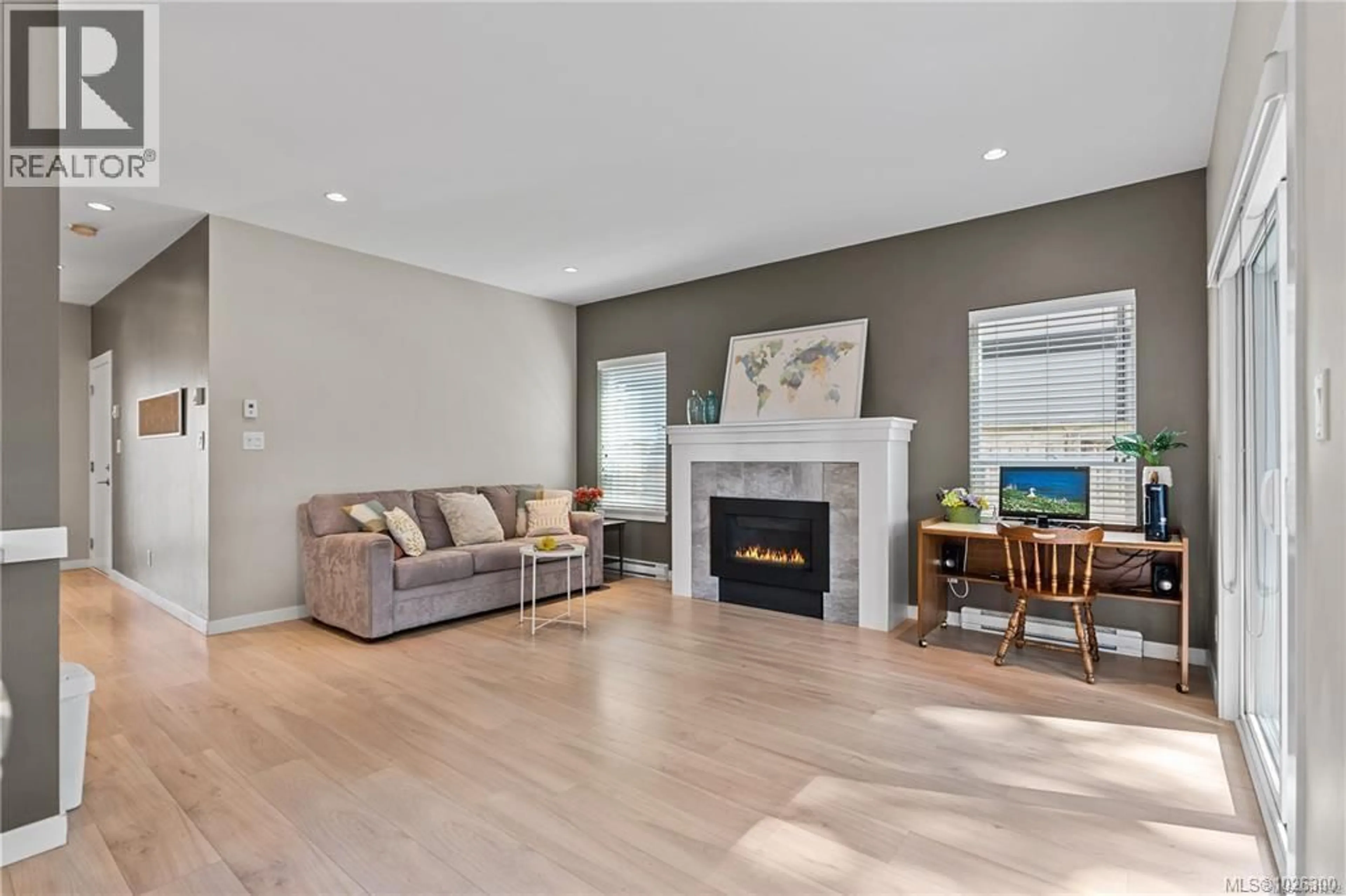 Living room with furniture, wood/laminate floor for 6554 STEEPLE CHASE, Sooke British Columbia V9Z0W3