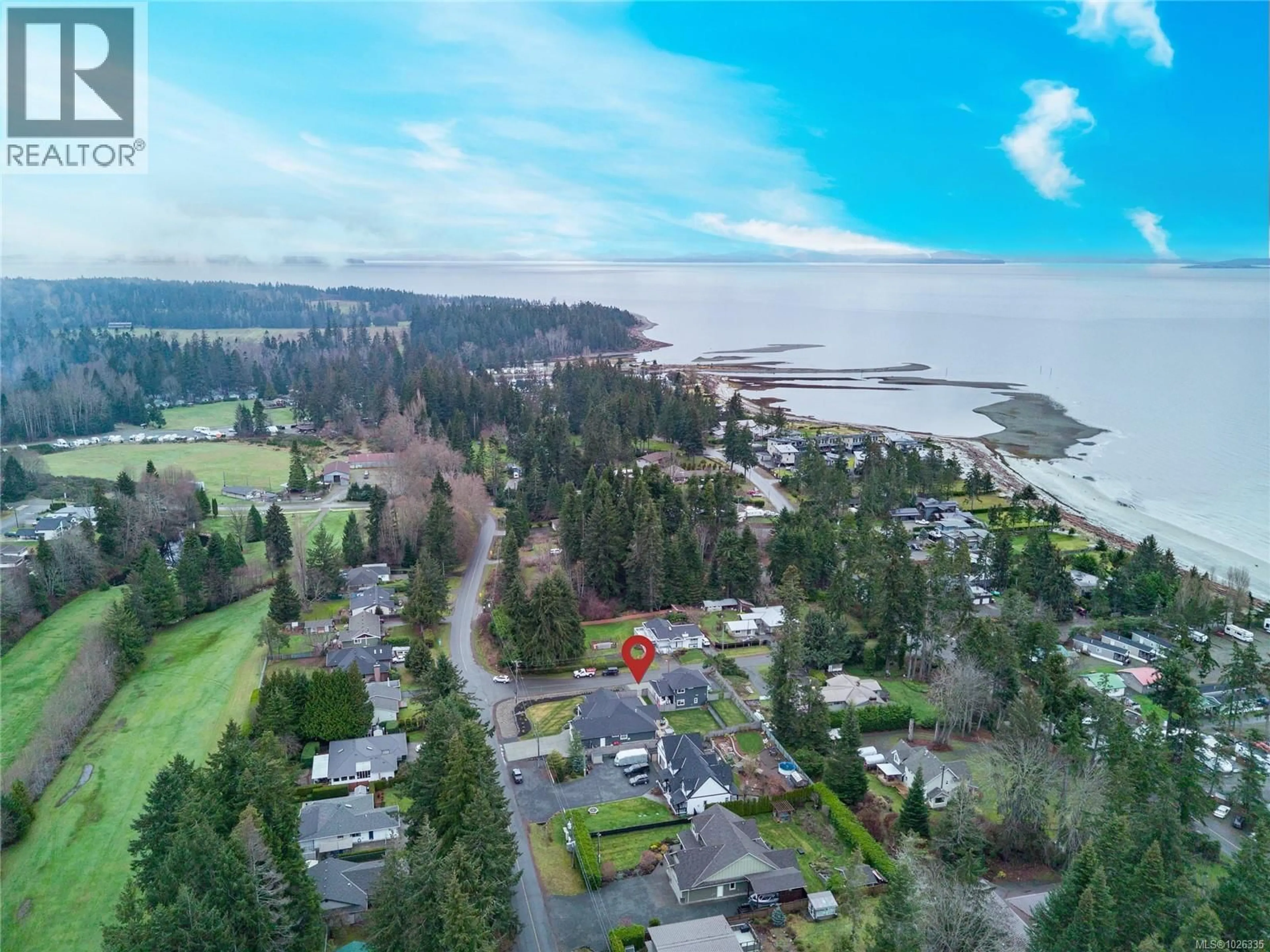 A pic from outside/outdoor area/front of a property/back of a property/a pic from drone, water/lake/river/ocean view for 8968 HENDERSON AVENUE, Black Creek British Columbia V9J1A4