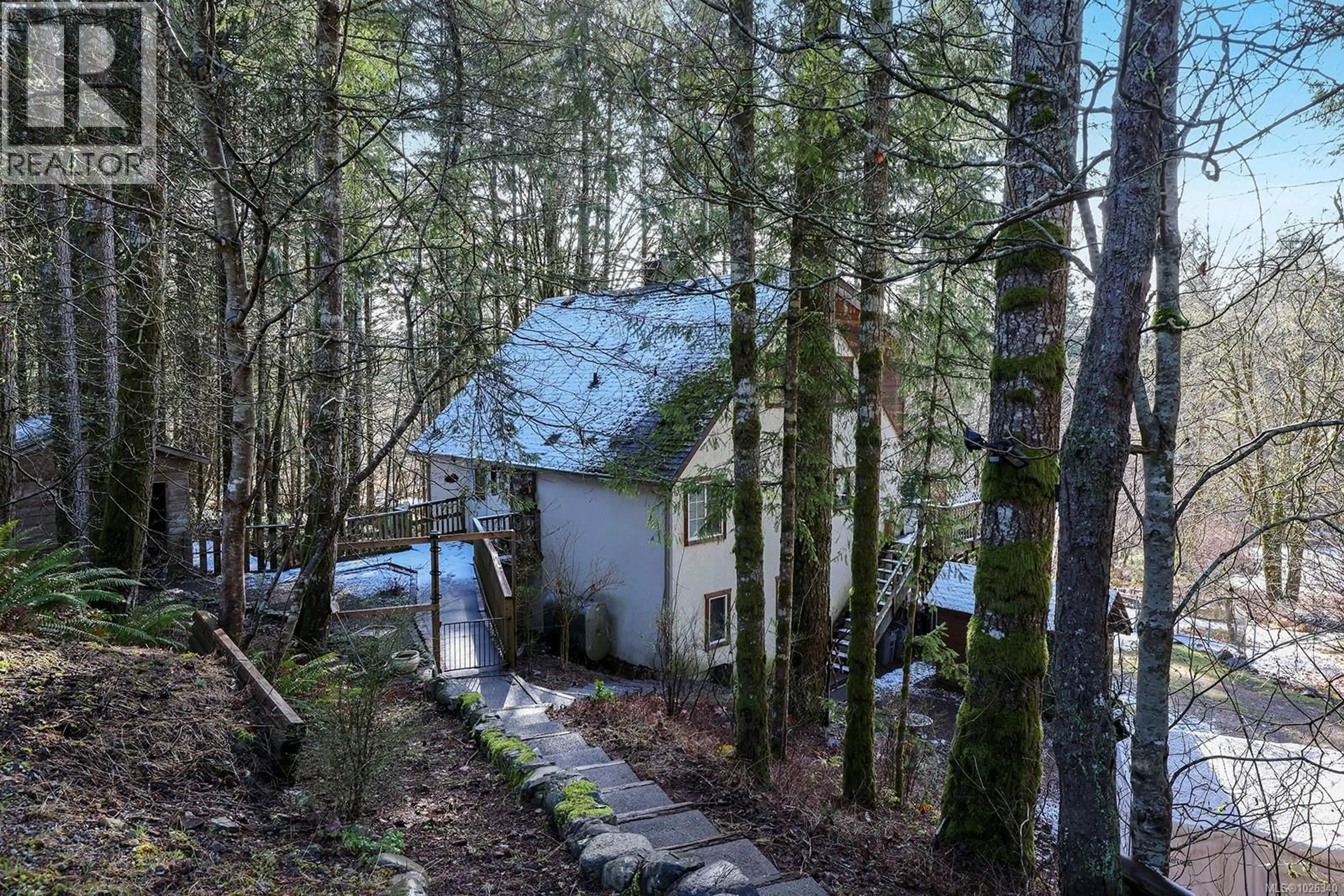 A pic from outside/outdoor area/front of a property/back of a property/a pic from drone, forest/trees view for 4026 MACAULAY ROAD, Black Creek British Columbia V9J1C8