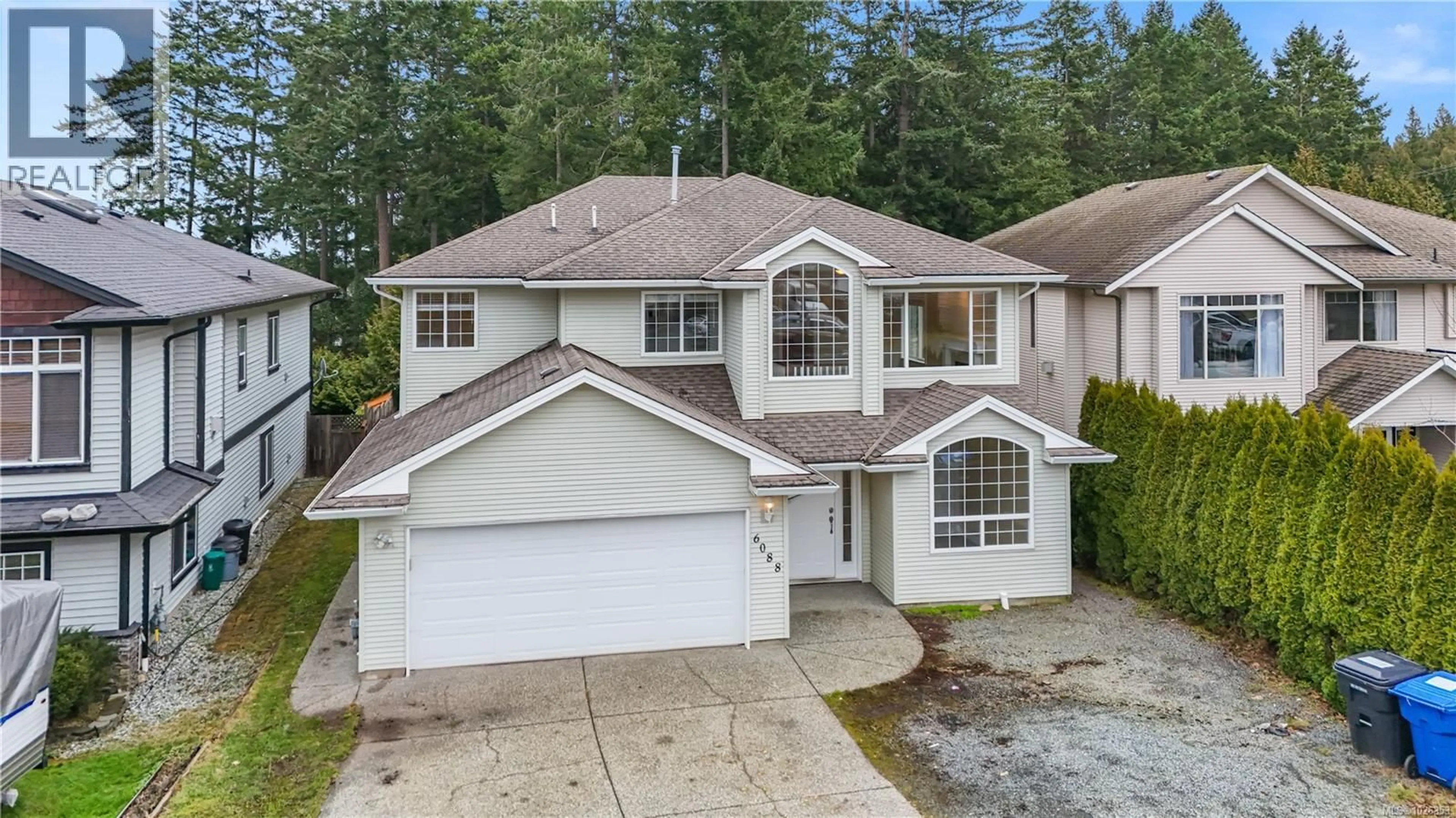 A pic from outside/outdoor area/front of a property/back of a property/a pic from drone, street for 6088 MCGIRR ROAD, Nanaimo British Columbia V9V1M1