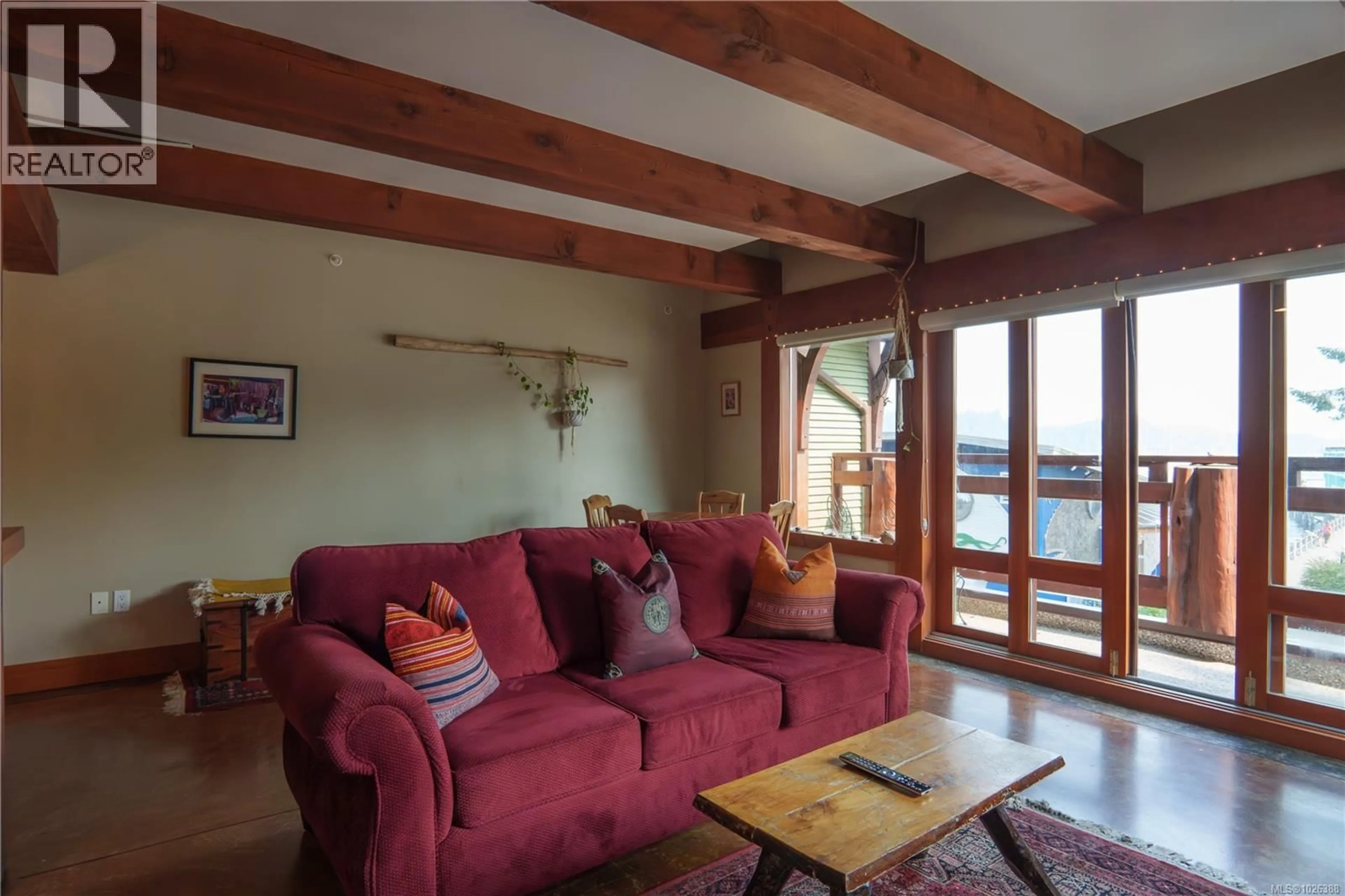 Living room with furniture, wood/laminate floor for 206 - 1645 CEDAR ROAD, Ucluelet British Columbia V0R3A0