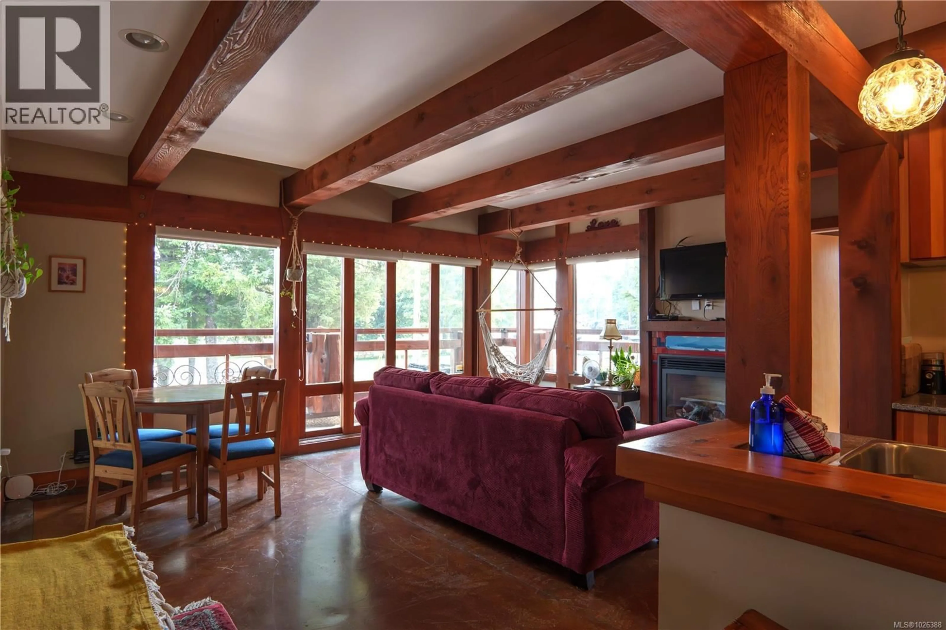 Living room with furniture, wood/laminate floor for 206 - 1645 CEDAR ROAD, Ucluelet British Columbia V0R3A0