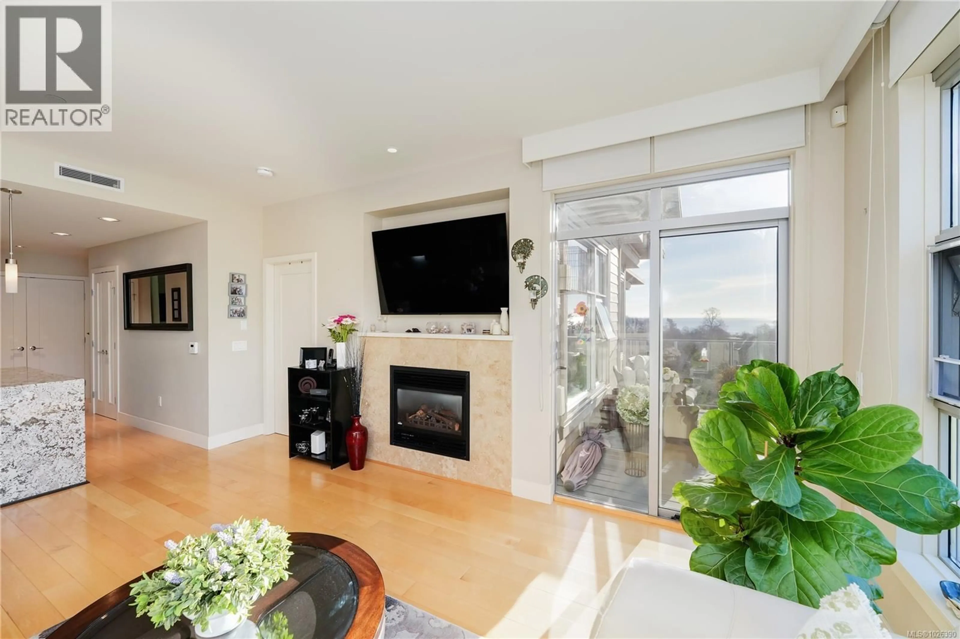 Living room with furniture, wood/laminate floor for 404 - 3234 HOLGATE LANE, Colwood British Columbia V9C0A6