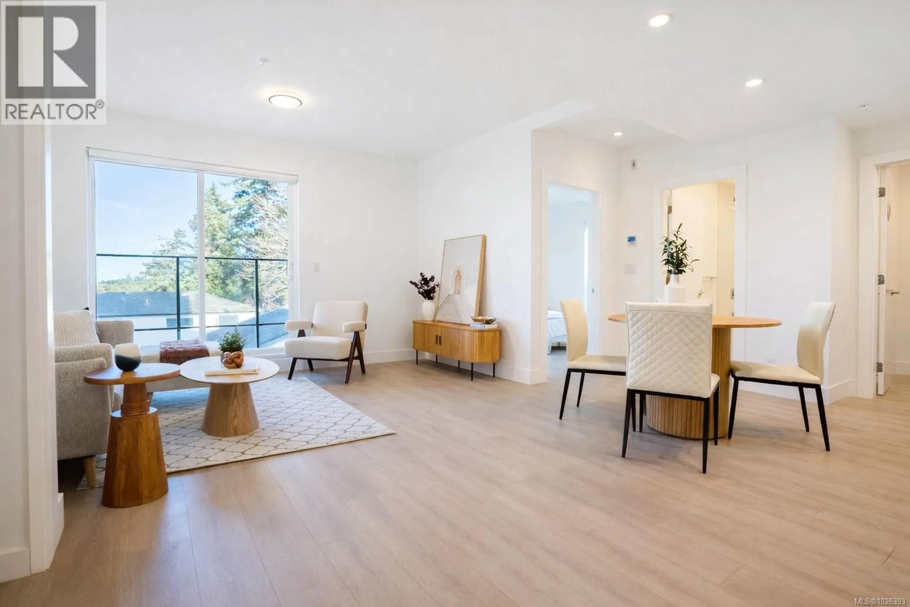 Living room with furniture, wood/laminate floor for 207 - 258 HELMCKEN ROAD, View Royal British Columbia V9B7G9