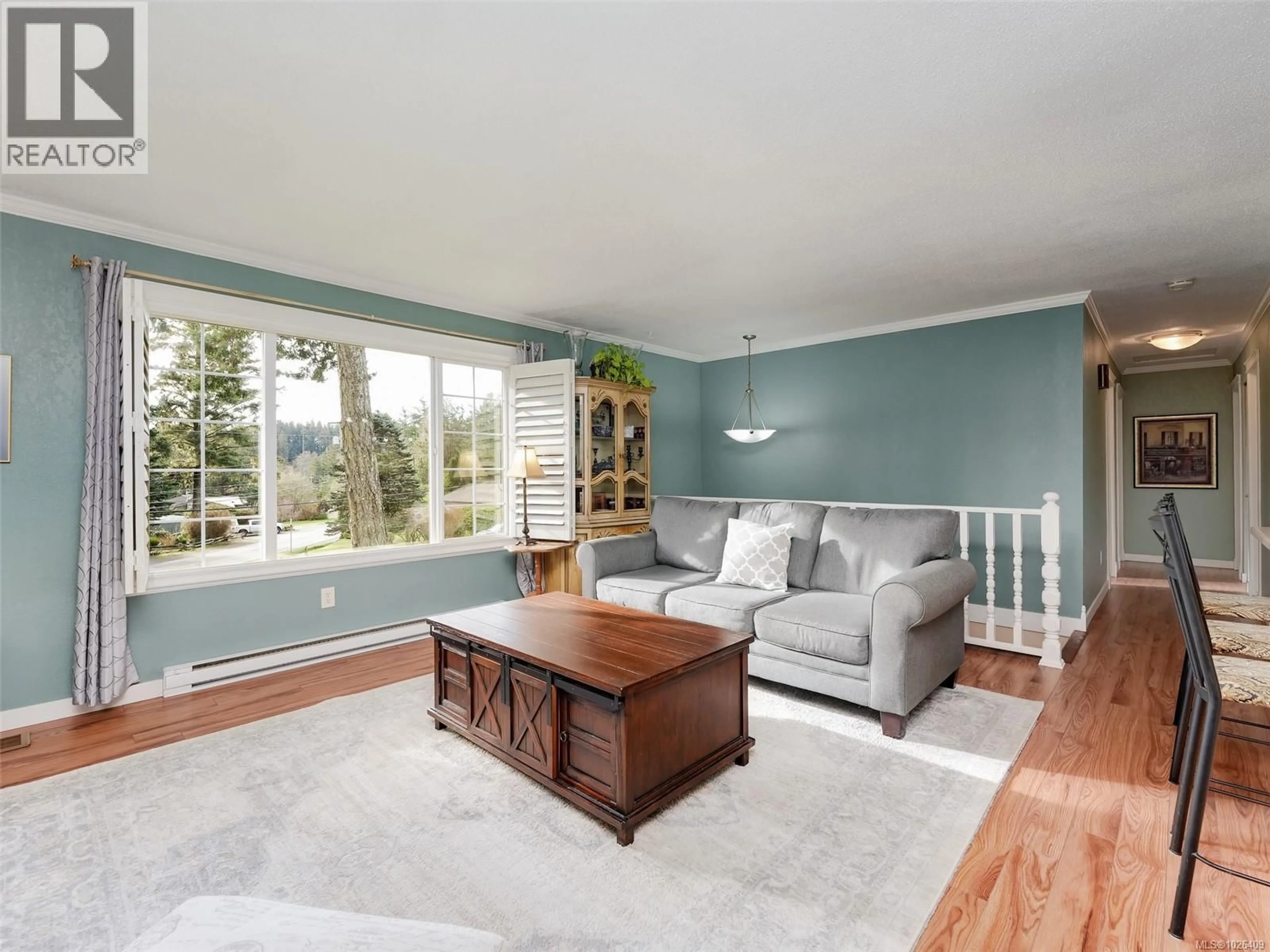 Living room with furniture, wood/laminate floor for 7058 WRIGHT ROAD, Sooke British Columbia V8Z0S5