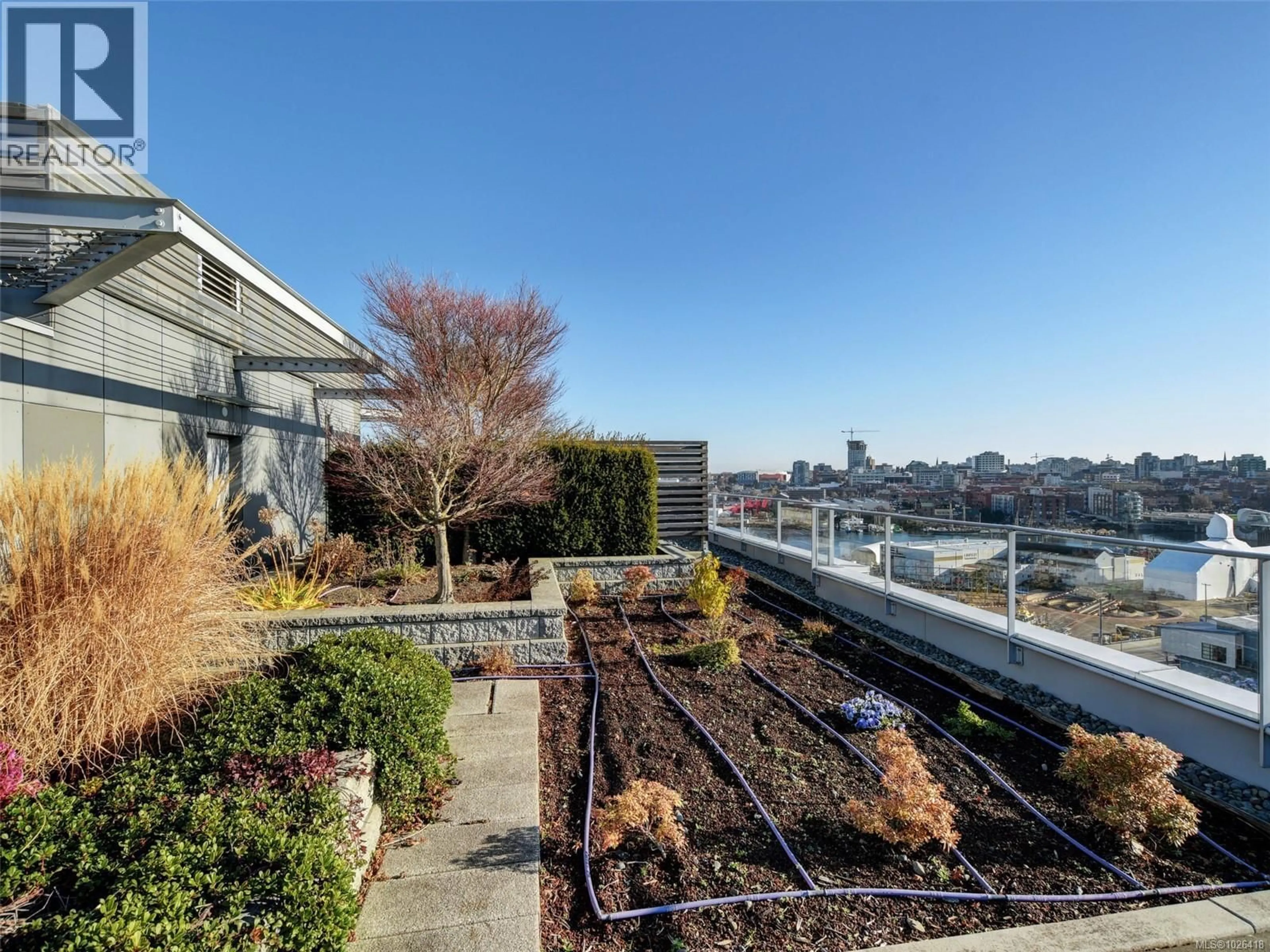 A pic from outside/outdoor area/front of a property/back of a property/a pic from drone, city buildings view from balcony for 705 - 373 TYEE ROAD, Victoria British Columbia V9A0B3