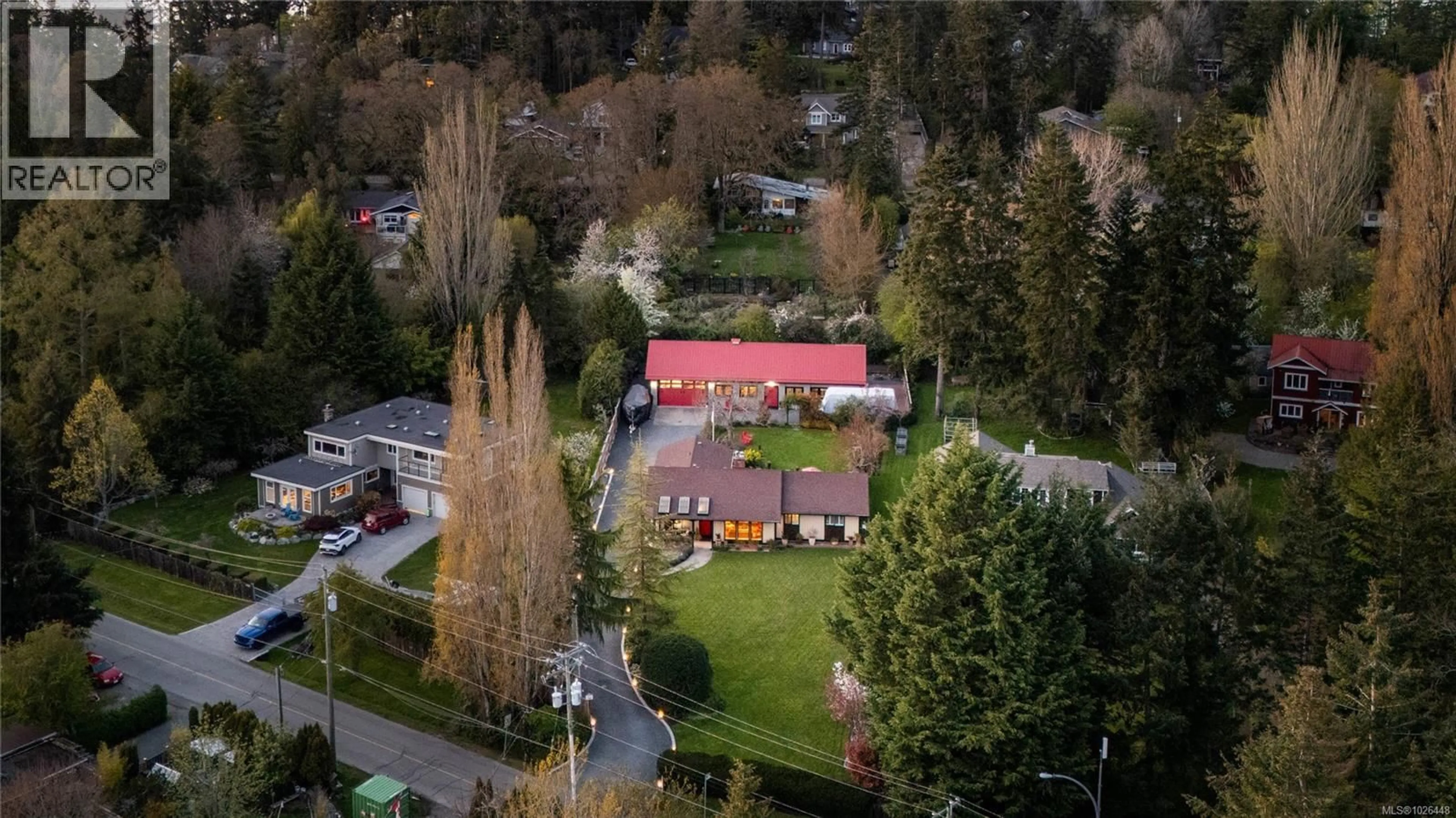 A pic from outside/outdoor area/front of a property/back of a property/a pic from drone, street for 10807 MADRONA DRIVE, North Saanich British Columbia V8L5P1