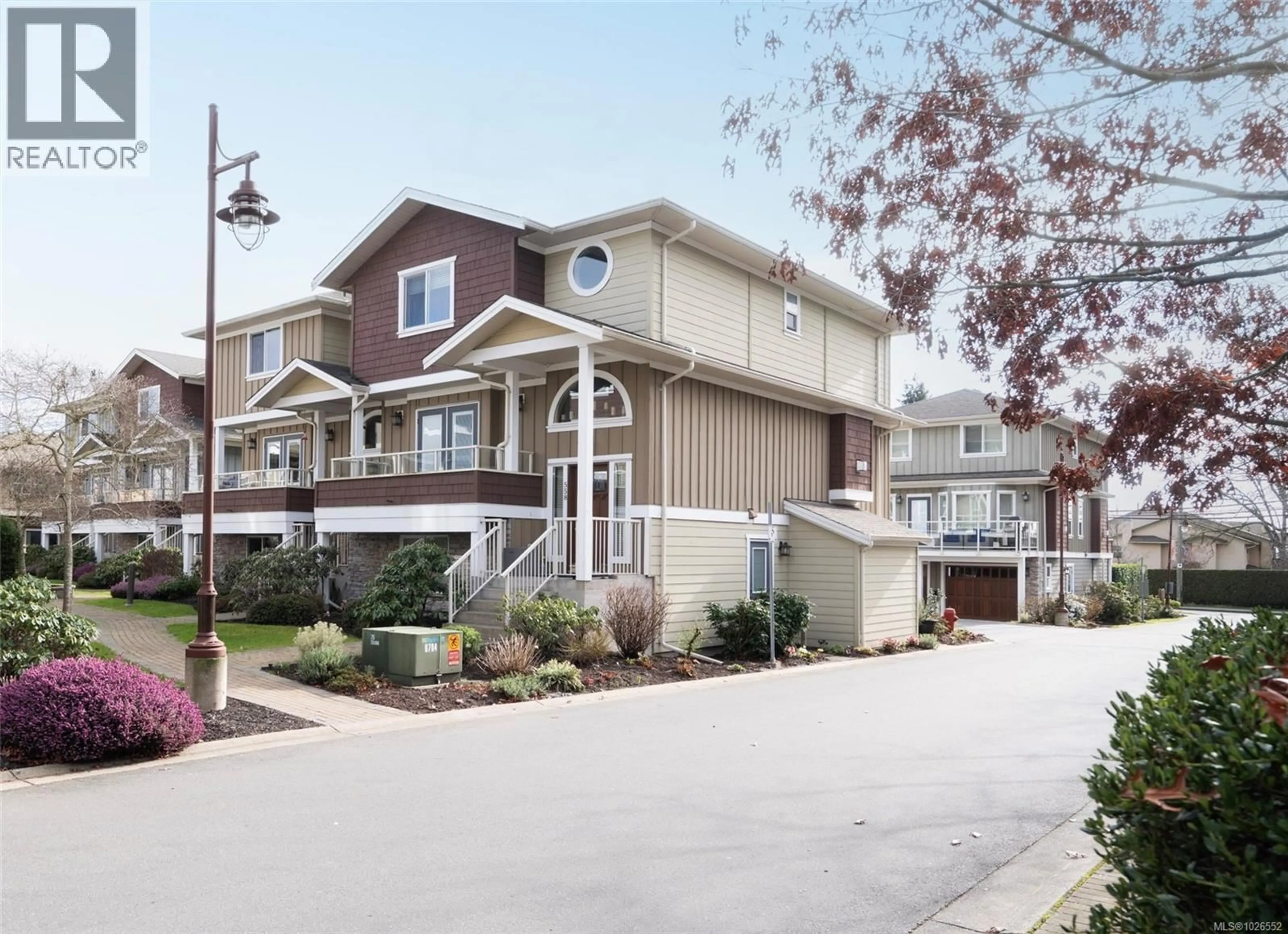 Home with vinyl exterior material, street for 560 HEATHERDALE LANE, Saanich British Columbia V8Z0A4