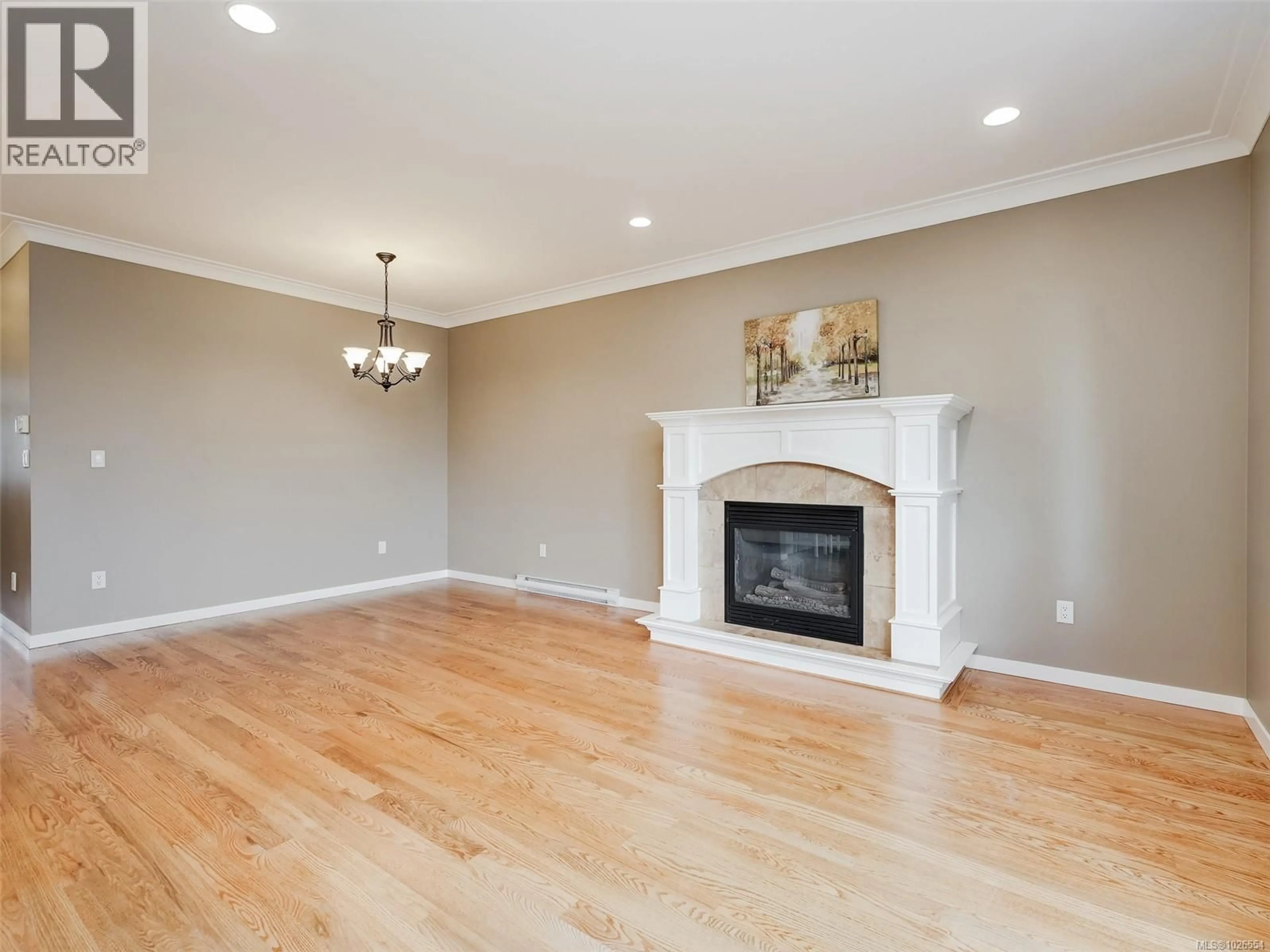 Living room with furniture, wood/laminate floor for 2075 DOVER STREET, Sooke British Columbia V9Z1L1