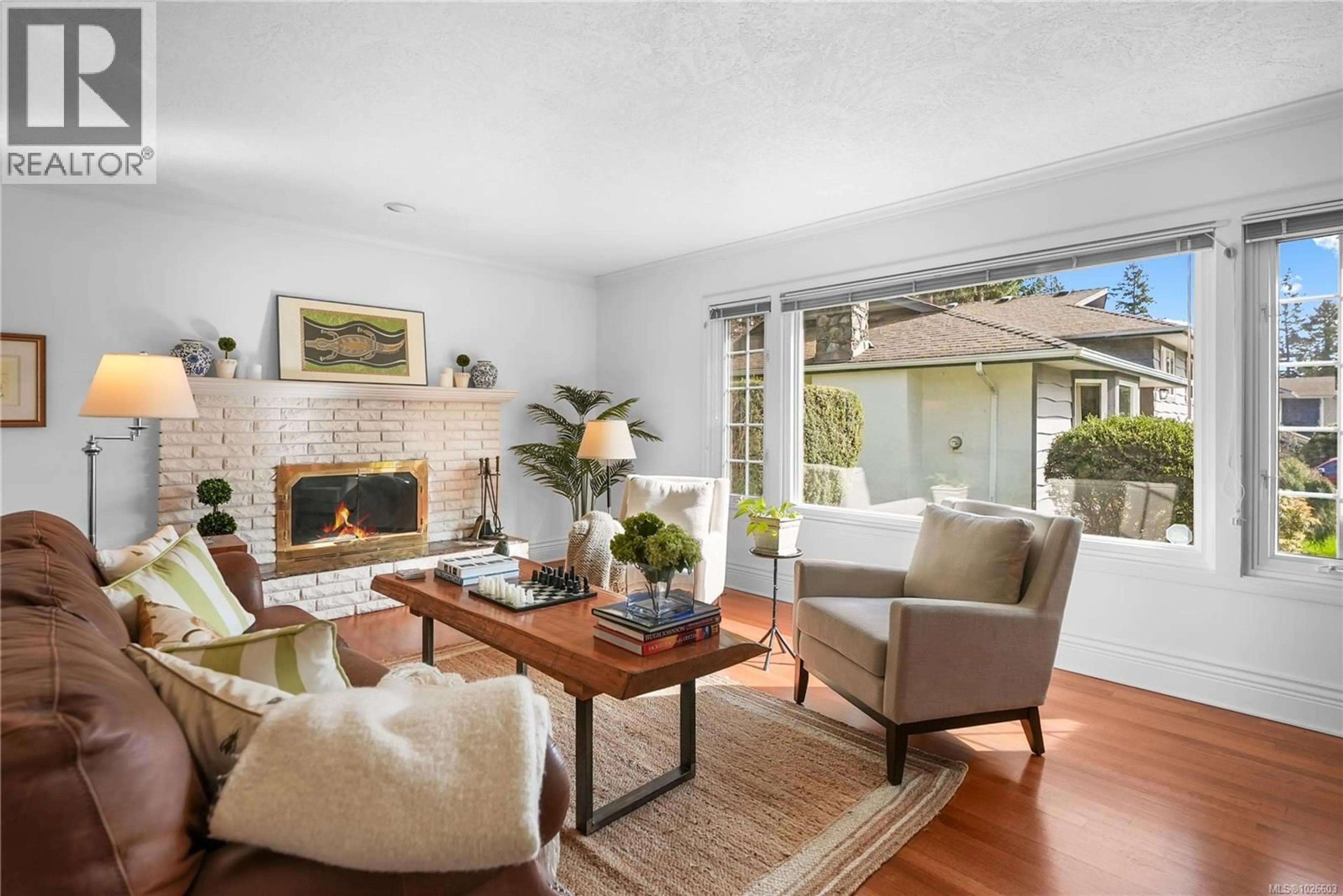 Living room with furniture, ceramic/tile floor for 2220 TASHY PLACE, Saanich British Columbia V8N4R6