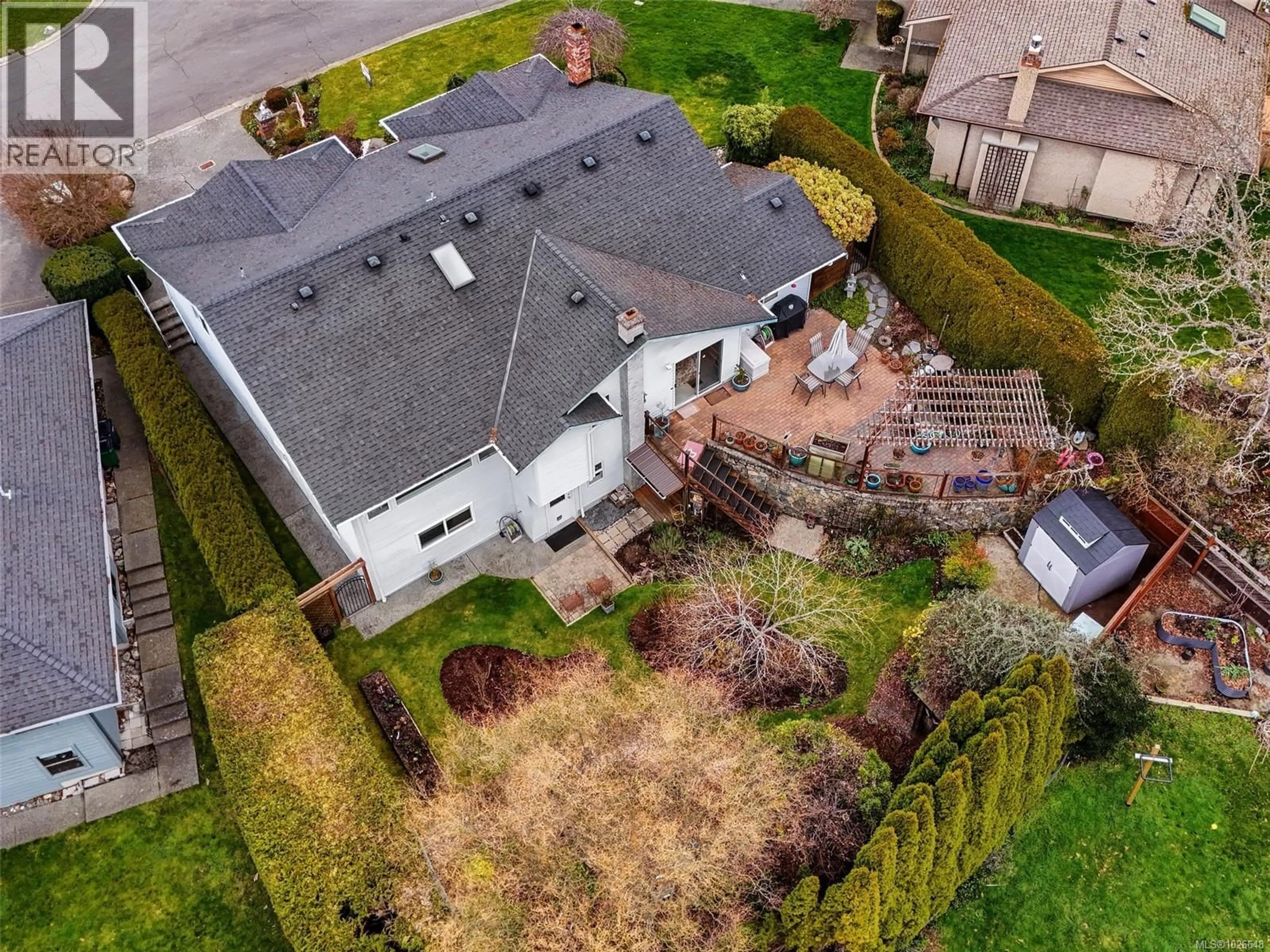 A pic from outside/outdoor area/front of a property/back of a property/a pic from drone, street for 4010 HOLLYRIDGE PLACE, Saanich British Columbia V8N5Z8