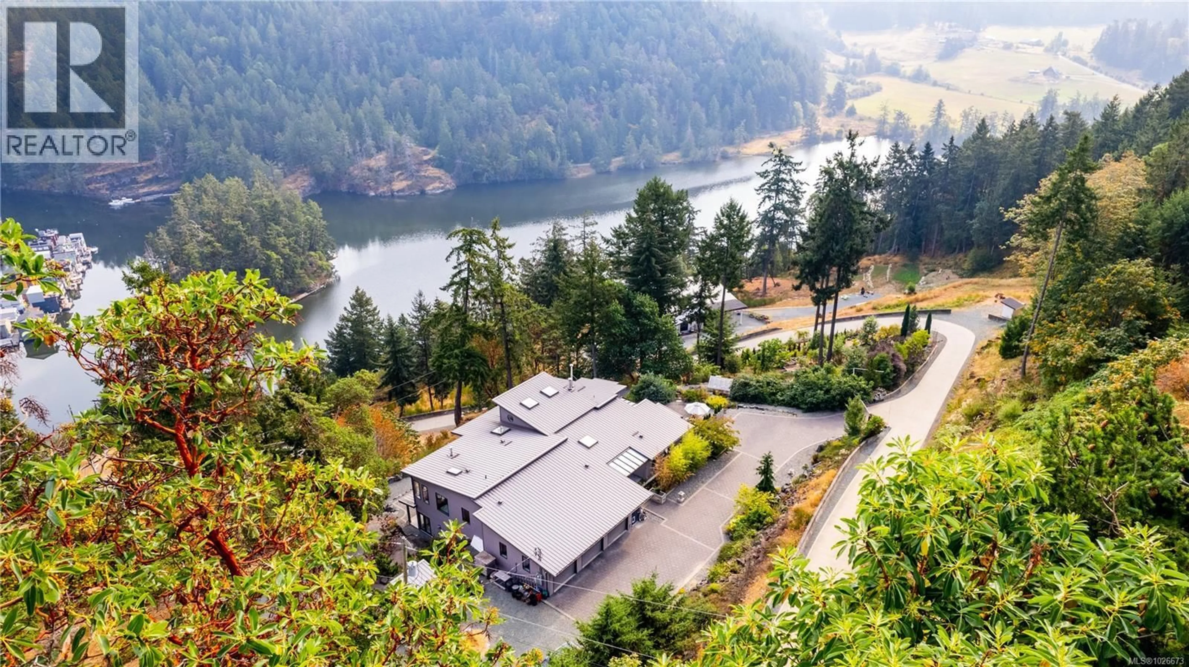 A pic from outside/outdoor area/front of a property/back of a property/a pic from drone, water/lake/river/ocean view for 6088 GENOA BAY ROAD, Duncan British Columbia V9L5Y5
