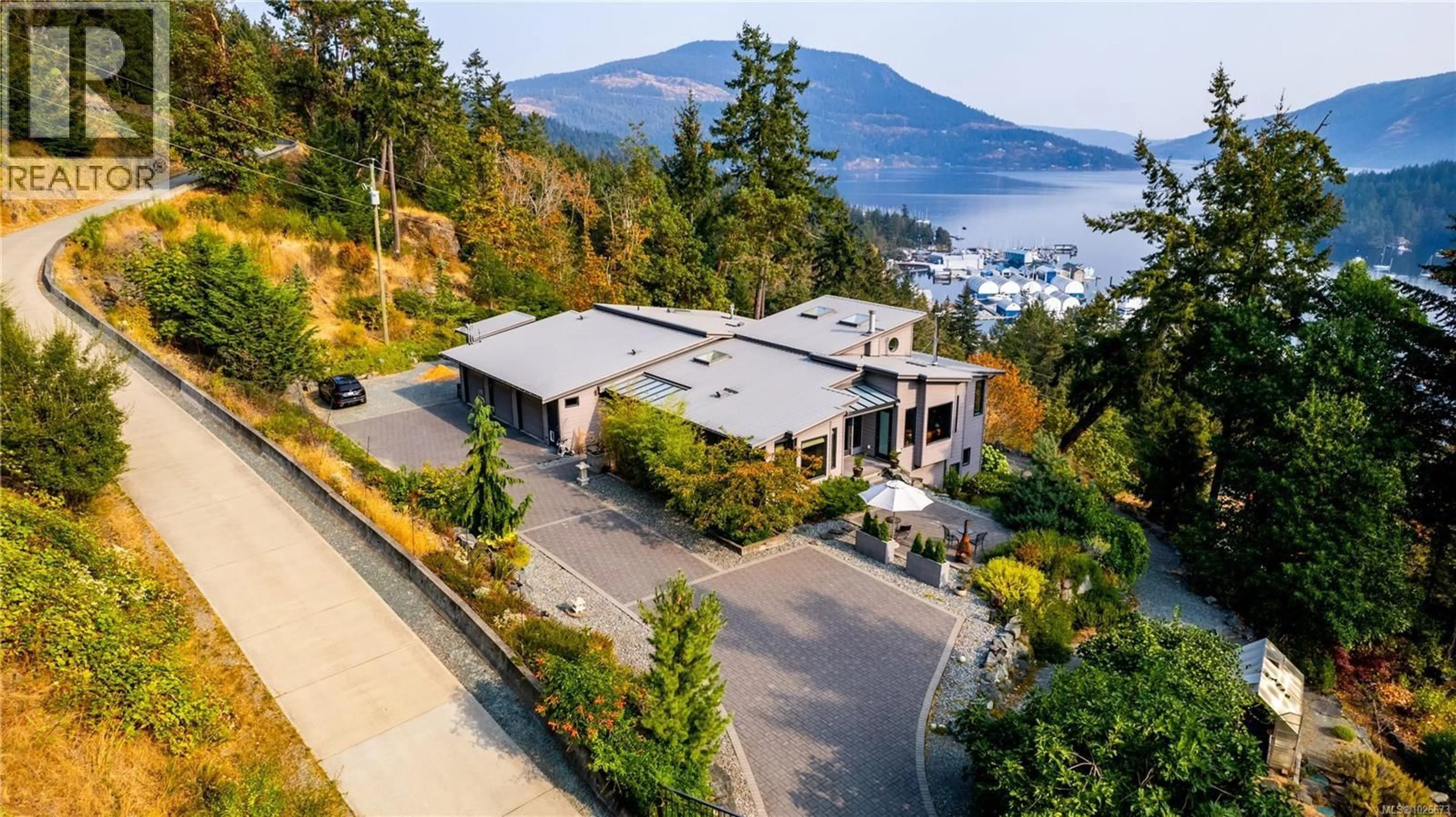 A pic from outside/outdoor area/front of a property/back of a property/a pic from drone, water/lake/river/ocean view for 6088 GENOA BAY ROAD, Duncan British Columbia V9L5Y5
