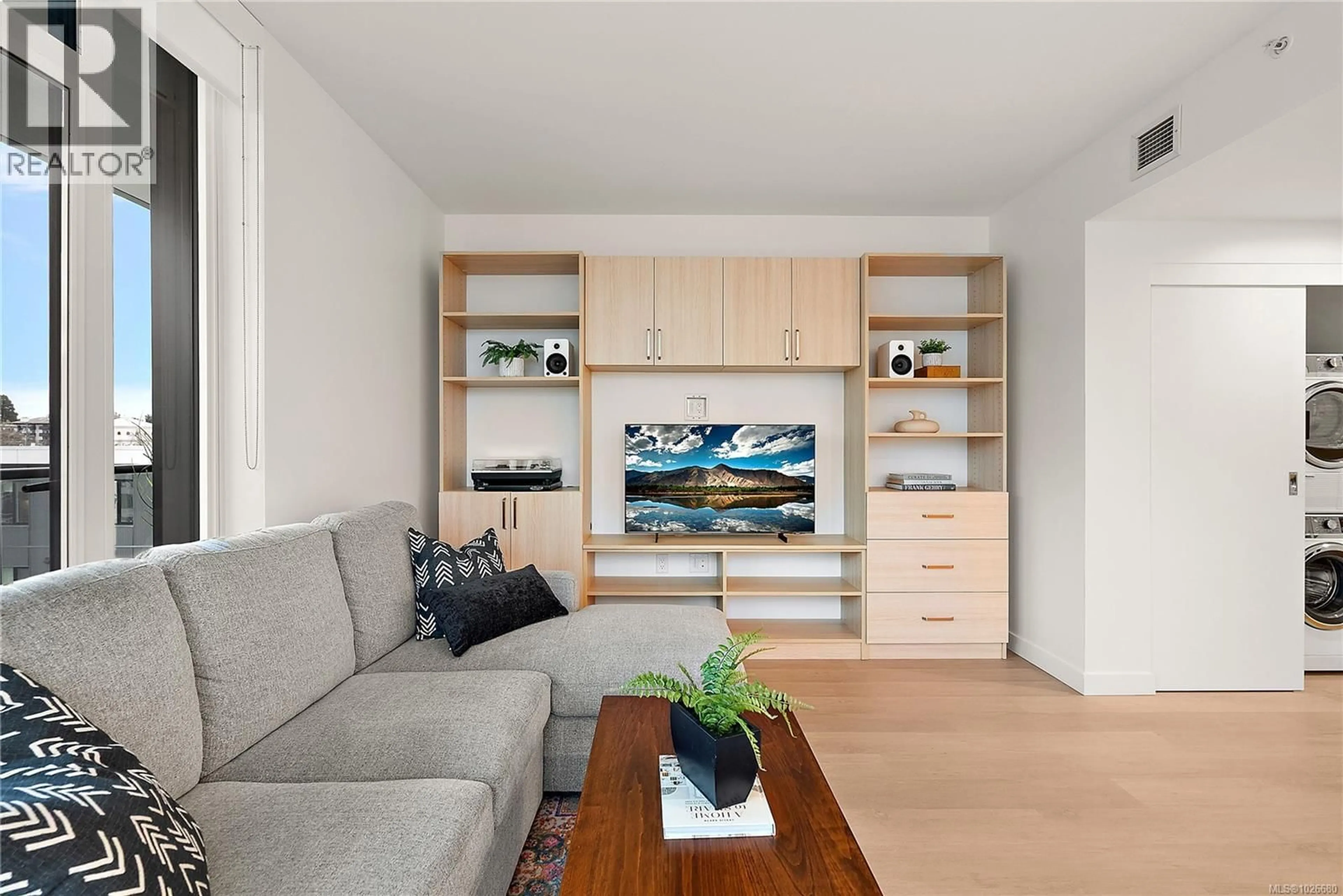 Living room with furniture, wood/laminate floor for 702 - 1100 YATES STREET, Victoria British Columbia V8V0H5