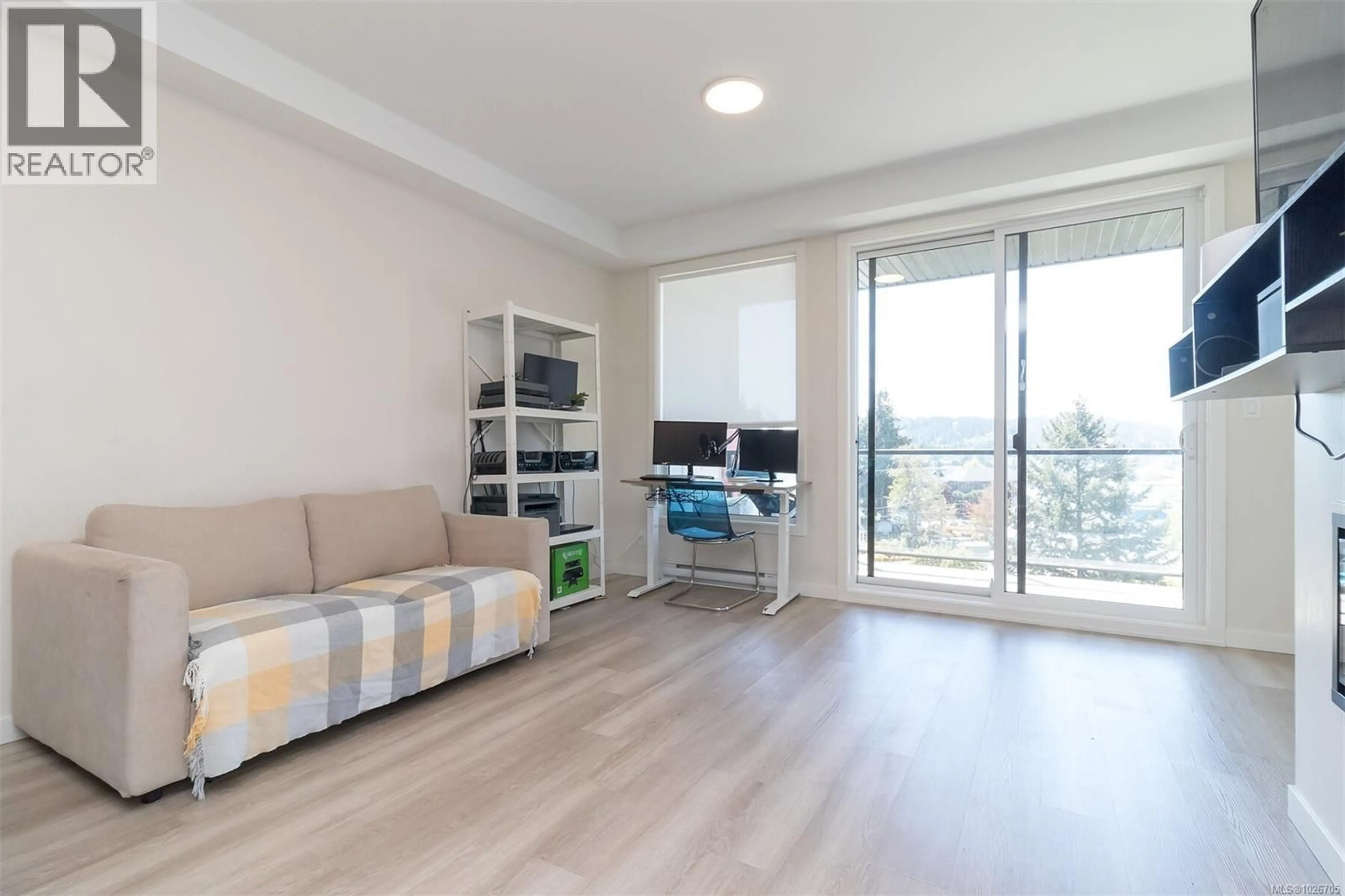 Living room with furniture, wood/laminate floor for 504 - 815 ORONO AVENUE, Langford British Columbia V9B2T9