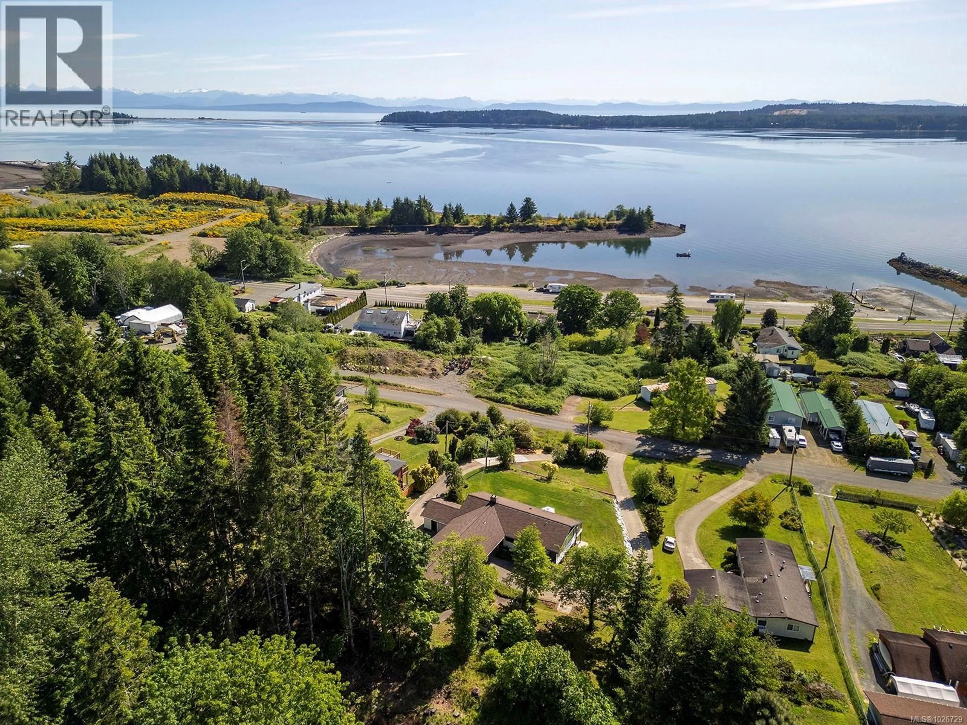 A pic from outside/outdoor area/front of a property/back of a property/a pic from drone, water/lake/river/ocean view for 5497 TAPPIN STREET, Union Bay British Columbia V0R3B0
