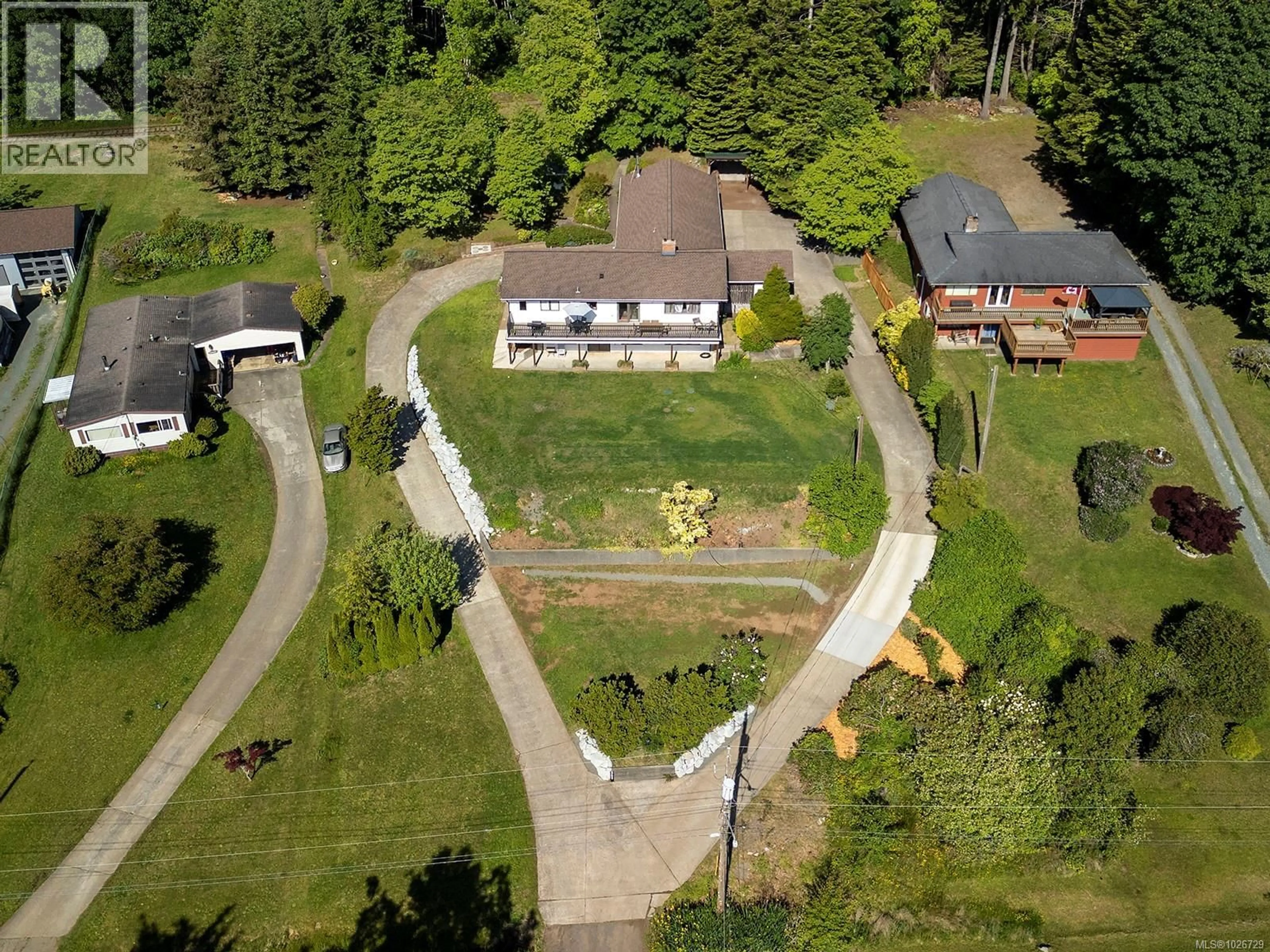 A pic from outside/outdoor area/front of a property/back of a property/a pic from drone, street for 5497 TAPPIN STREET, Union Bay British Columbia V0R3B0