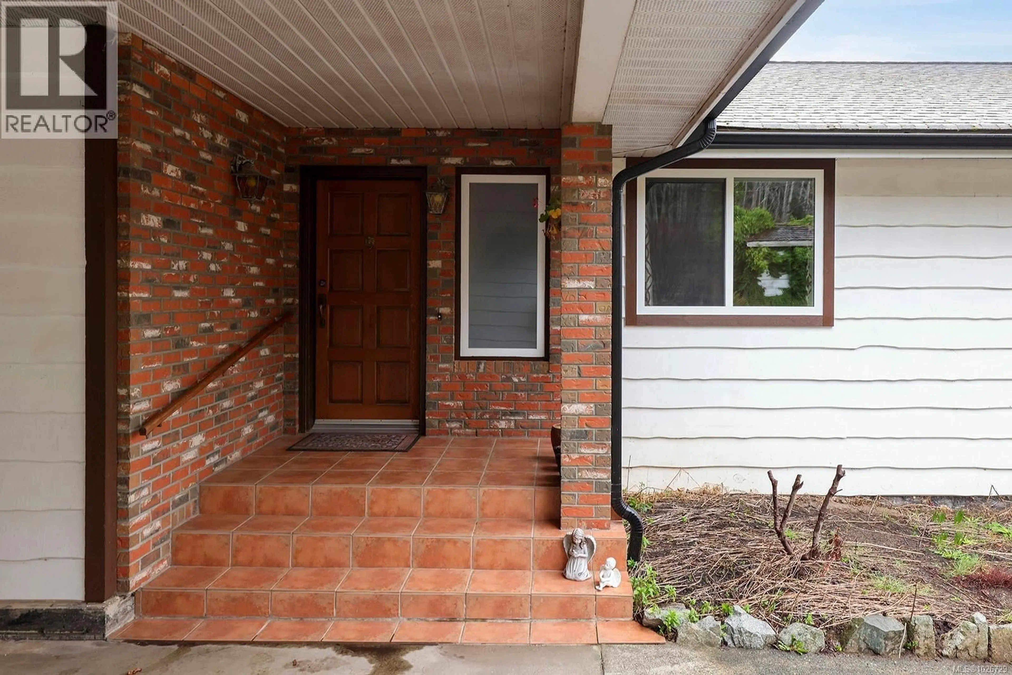 Home with brick exterior material, street for 5497 TAPPIN STREET, Union Bay British Columbia V0R3B0