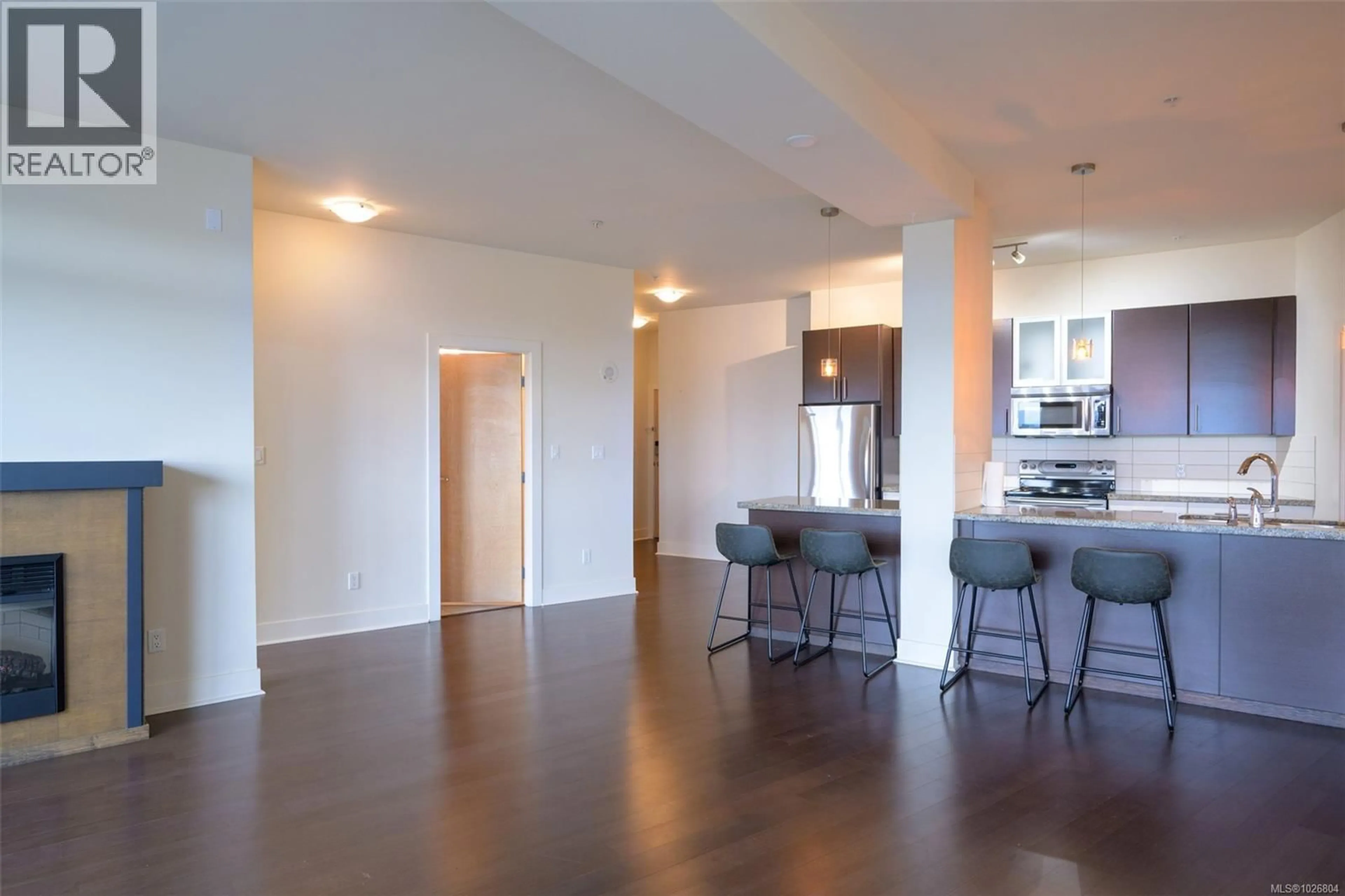 Open concept kitchen, wood/laminate floor for 728 - 2745 VETERANS MEMORIAL PARKWAY, Langford British Columbia V8X5C6