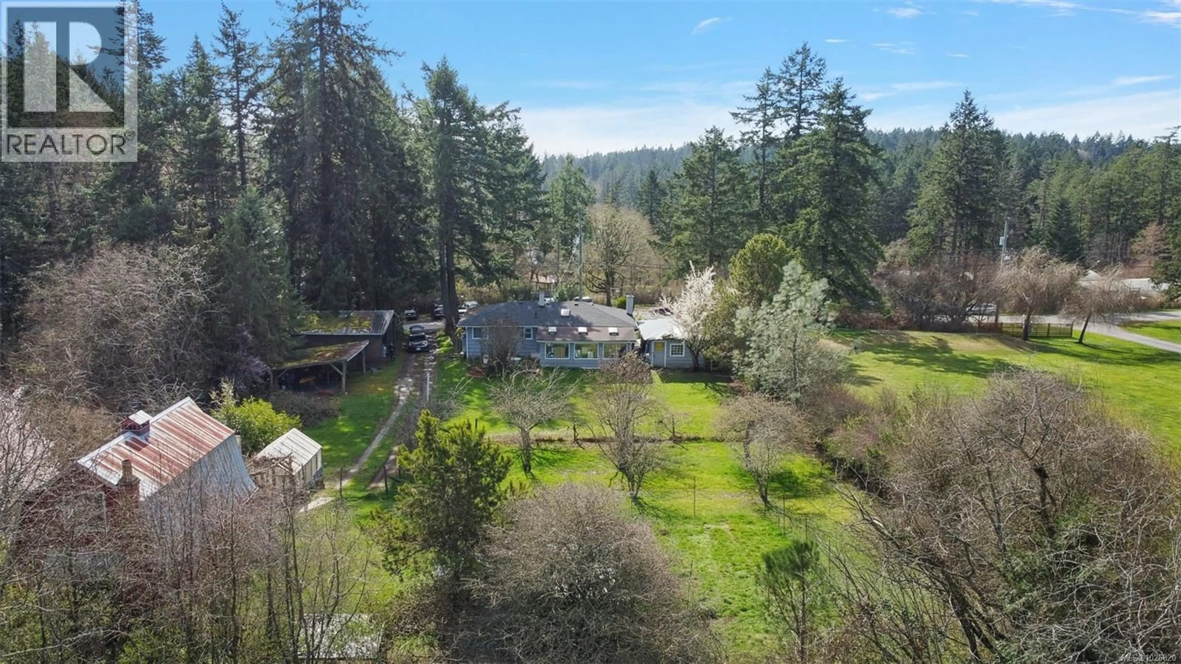 A pic from outside/outdoor area/front of a property/back of a property/a pic from drone, forest/trees view for 476 QUAYLE ROAD, Saanich British Columbia V9E2J7