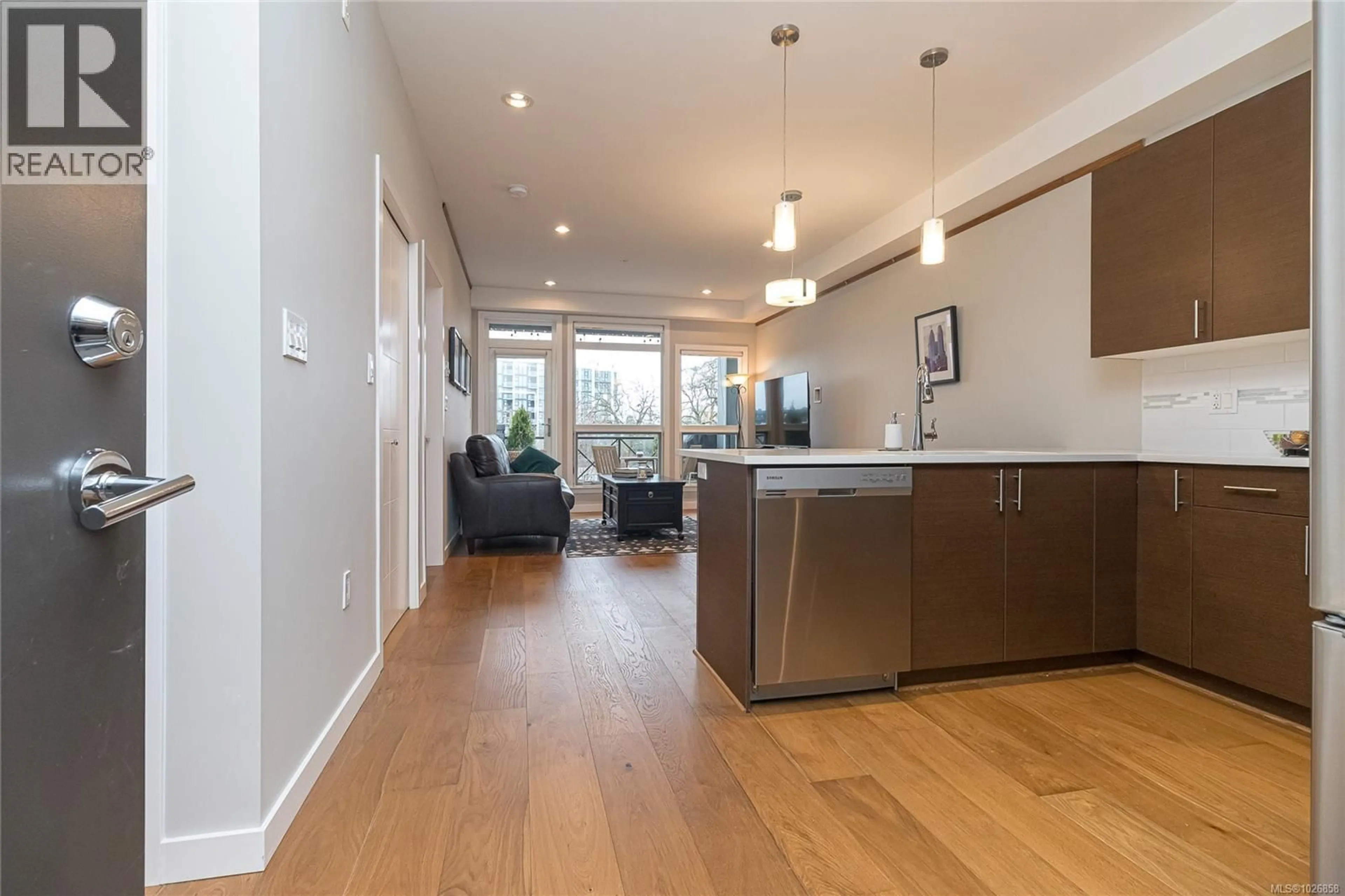 Open concept kitchen, wood/laminate floor for 303 - 924 ESQUIMALT ROAD, Esquimalt British Columbia V9A3P2