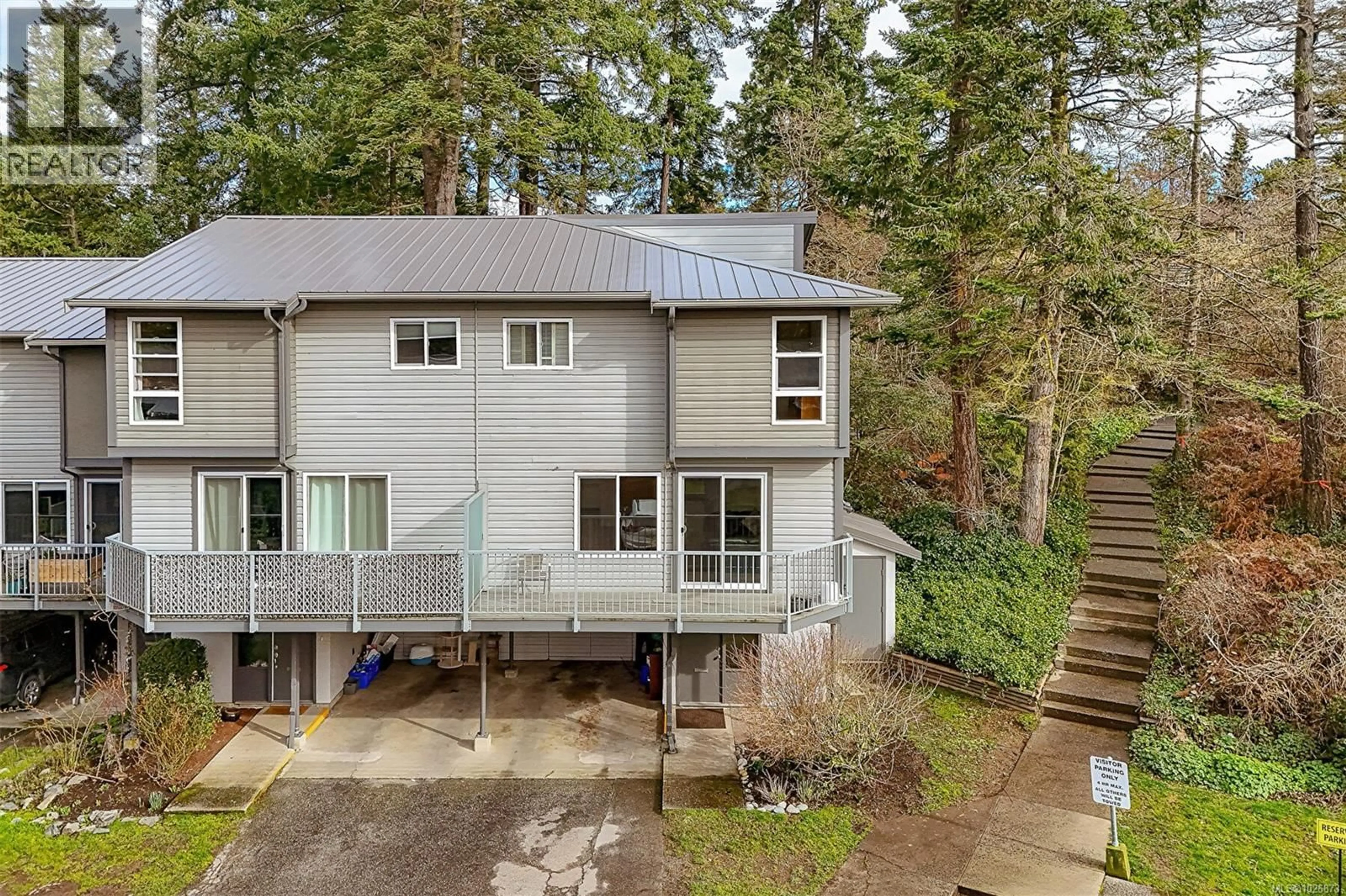 A pic from outside/outdoor area/front of a property/back of a property/a pic from drone, forest/trees view for 590 CARNATION PLACE, Saanich British Columbia V8Z6G5