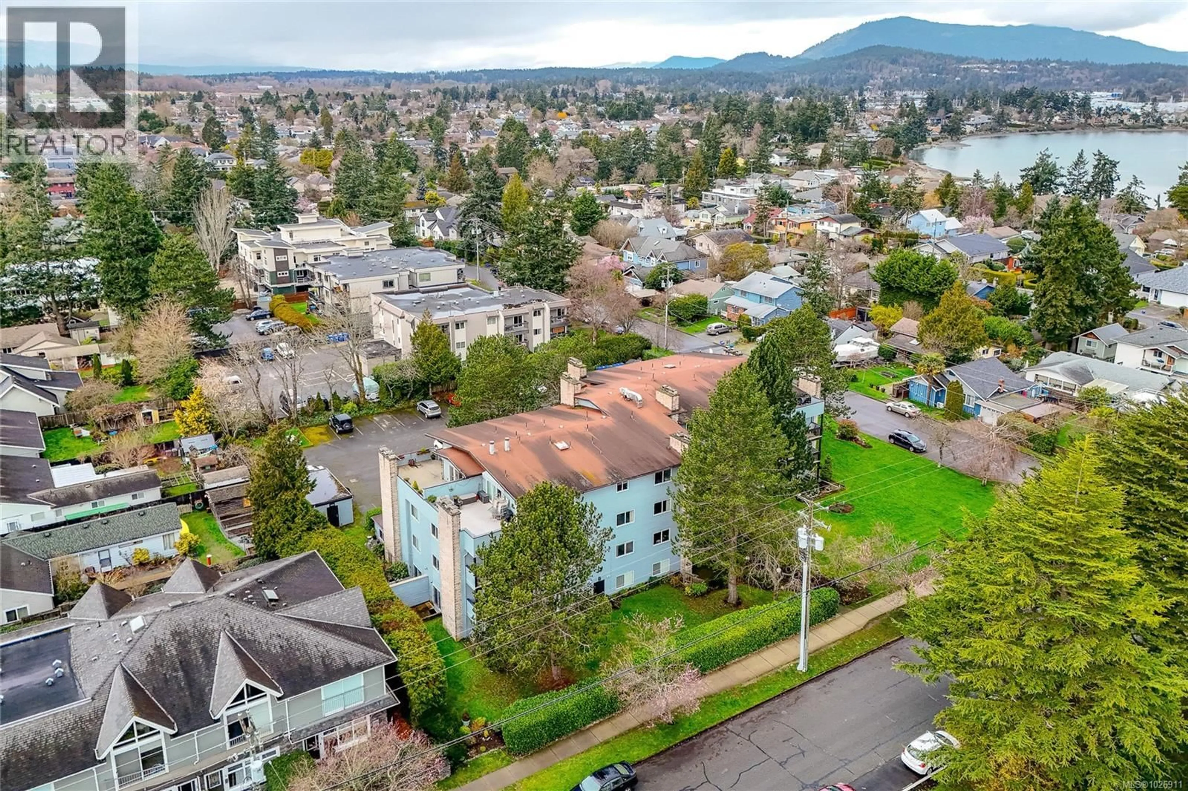 A pic from outside/outdoor area/front of a property/back of a property/a pic from drone, mountain view for 204 - 10160 THIRD STREET, Sidney British Columbia V8L3B6