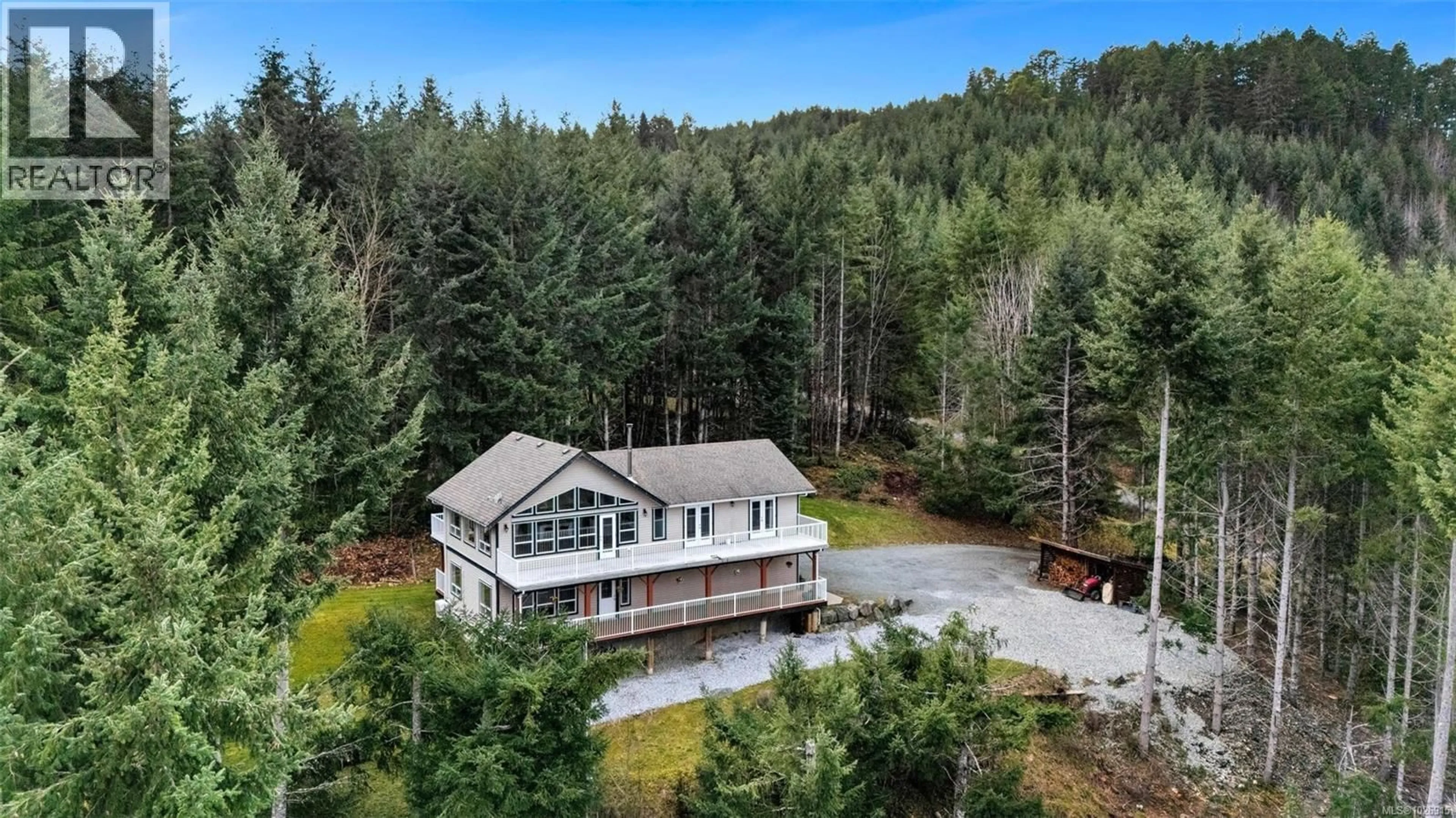 A pic from outside/outdoor area/front of a property/back of a property/a pic from drone, water/lake/river/ocean view for 1130 COUGAR RIDGE ROAD, Shawnigan Lake British Columbia V8H2C2