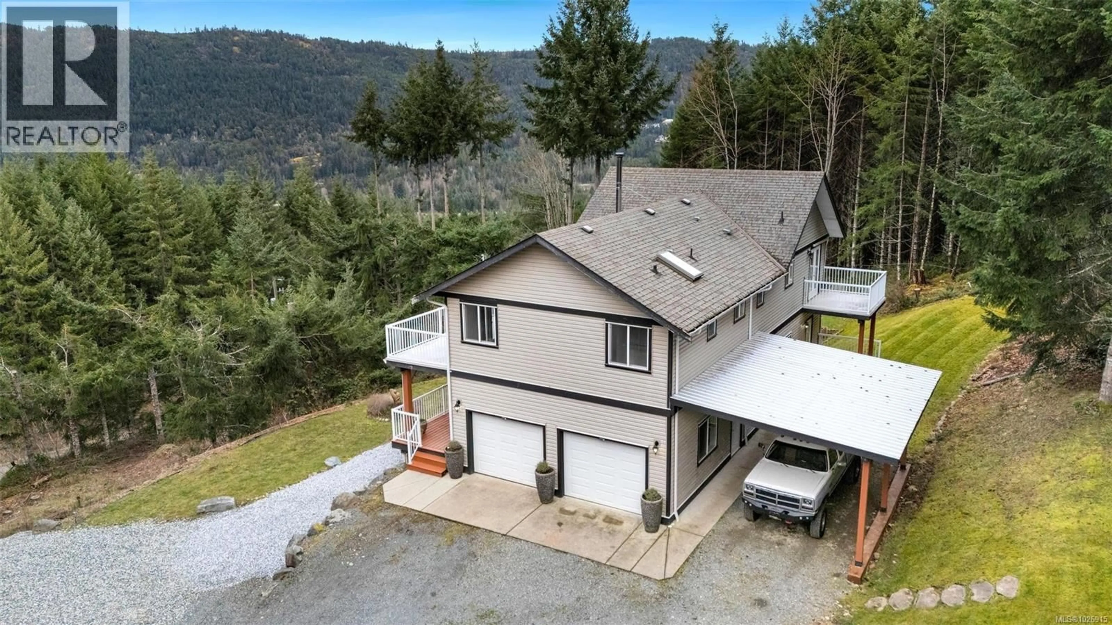 A pic from outside/outdoor area/front of a property/back of a property/a pic from drone, mountain view for 1130 COUGAR RIDGE ROAD, Shawnigan Lake British Columbia V8H2C2