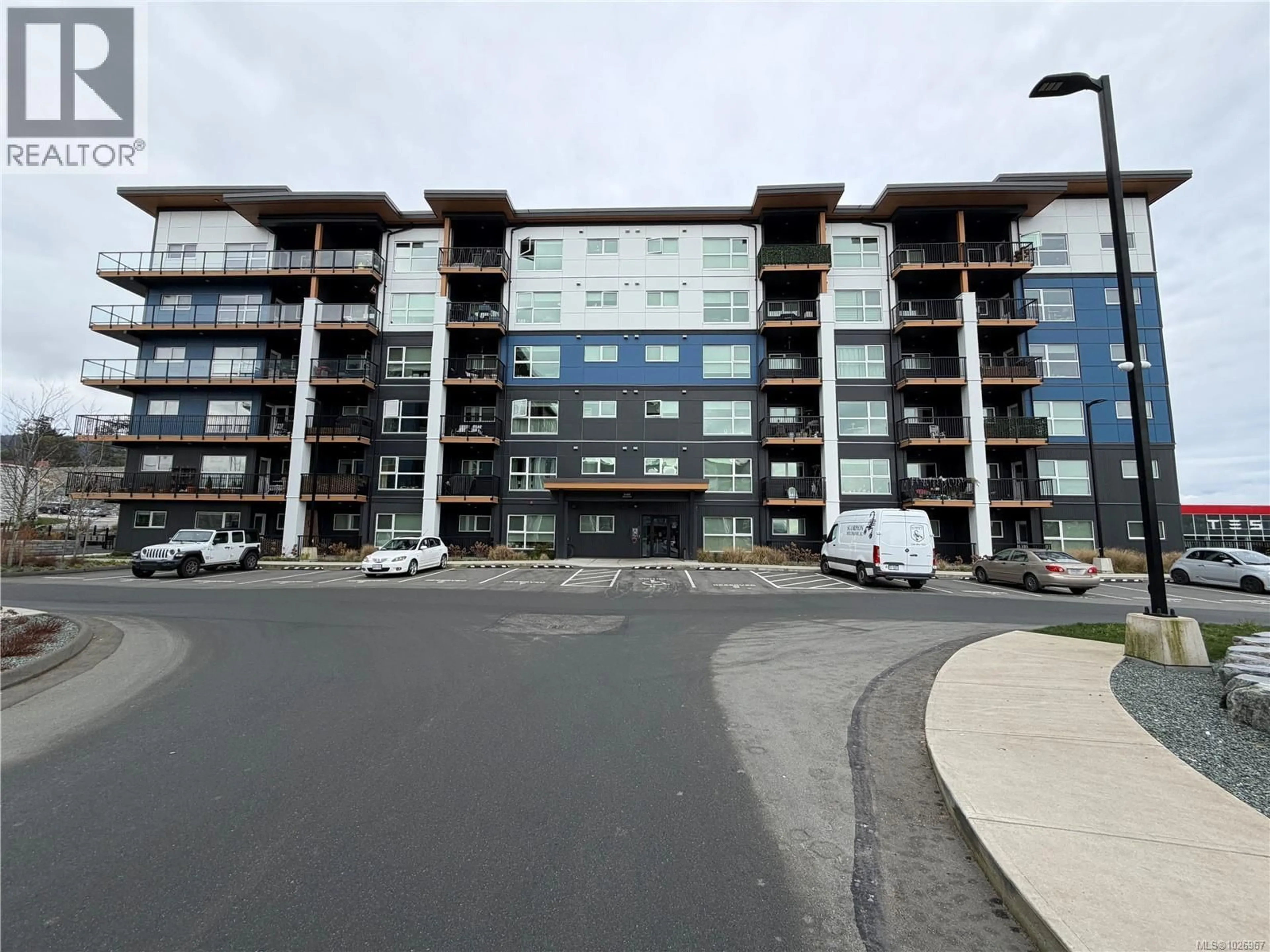 A pic from outside/outdoor area/front of a property/back of a property/a pic from drone, building for 301 - 2461 GATEWAY ROAD, Langford British Columbia V9B5X3