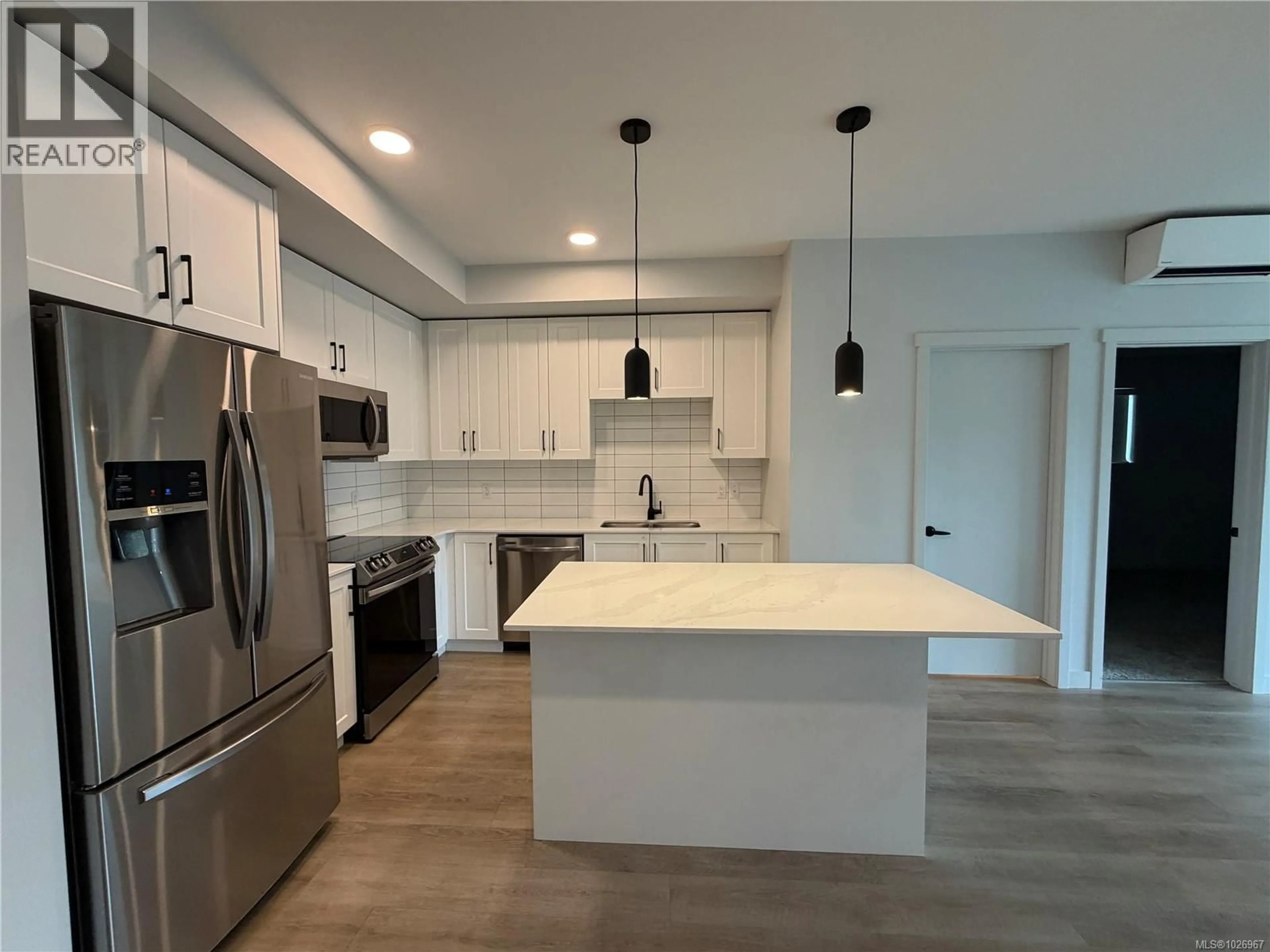 Open concept kitchen, unknown for 301 - 2461 GATEWAY ROAD, Langford British Columbia V9B5X3