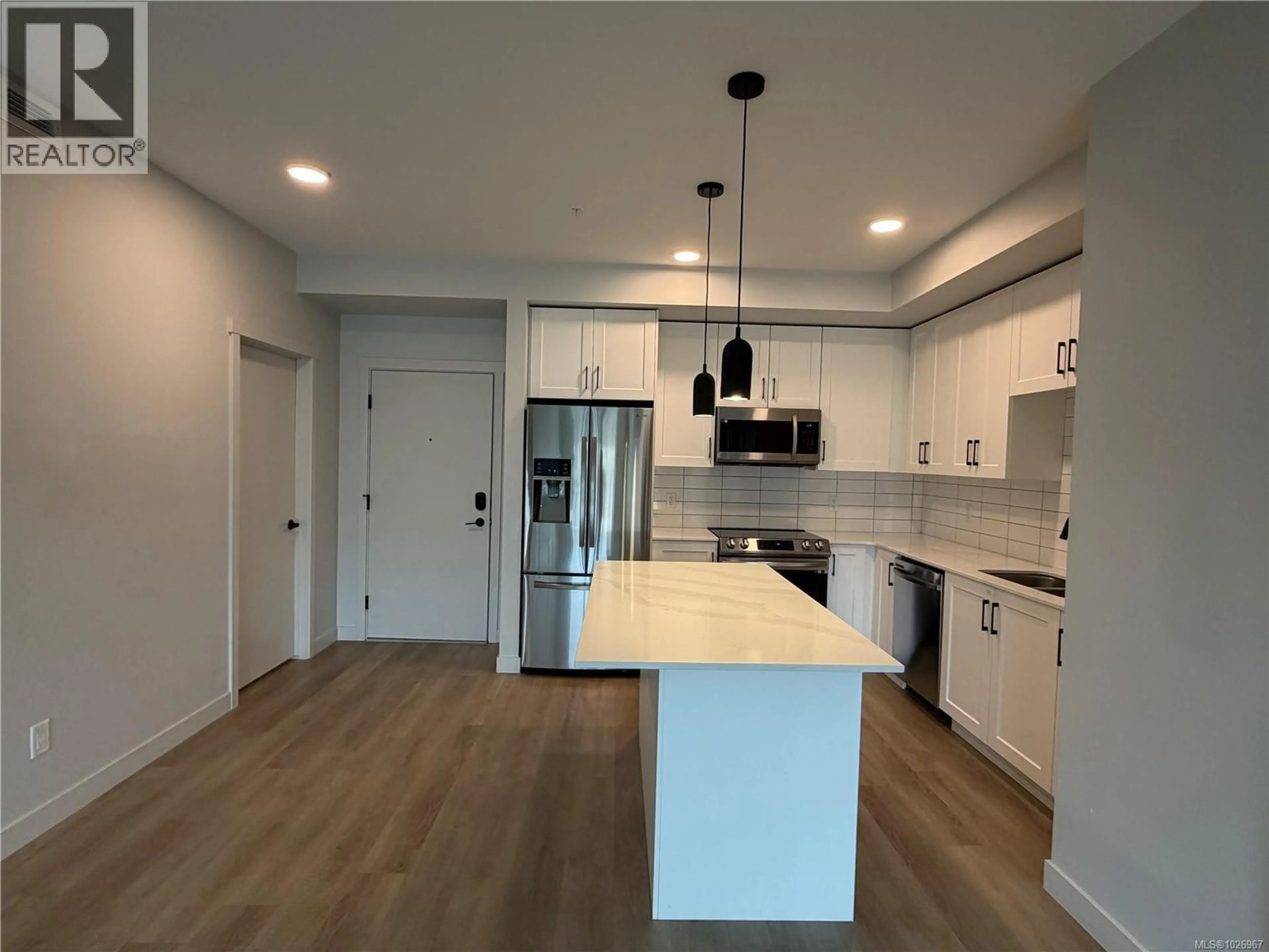 Open concept kitchen, unknown for 301 - 2461 GATEWAY ROAD, Langford British Columbia V9B5X3