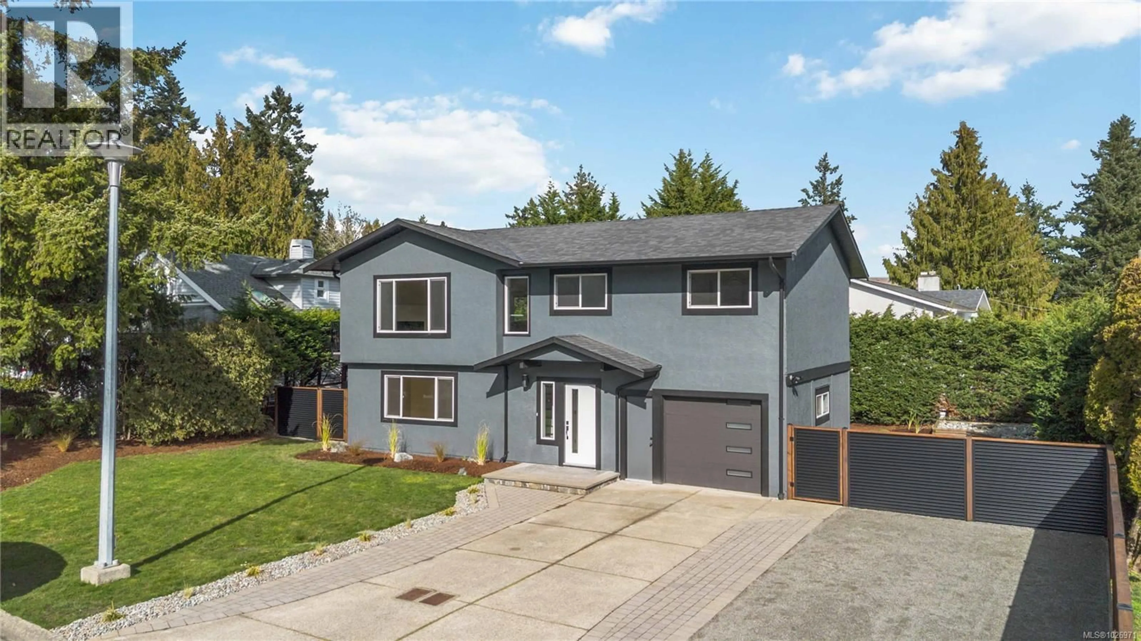 Home with vinyl exterior material, street for 1964 GENOA PLACE, Central Saanich British Columbia V8M1M1