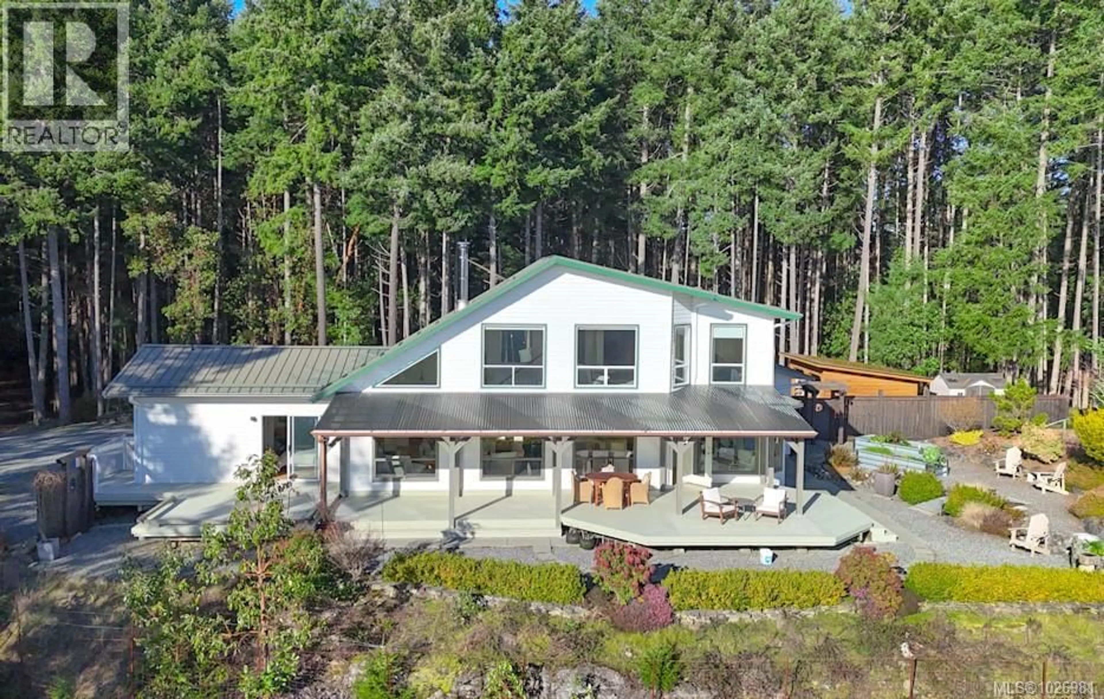A pic from outside/outdoor area/front of a property/back of a property/a pic from drone, forest/trees view for 1115 COATS DRIVE, Gabriola Island British Columbia V0R1X4