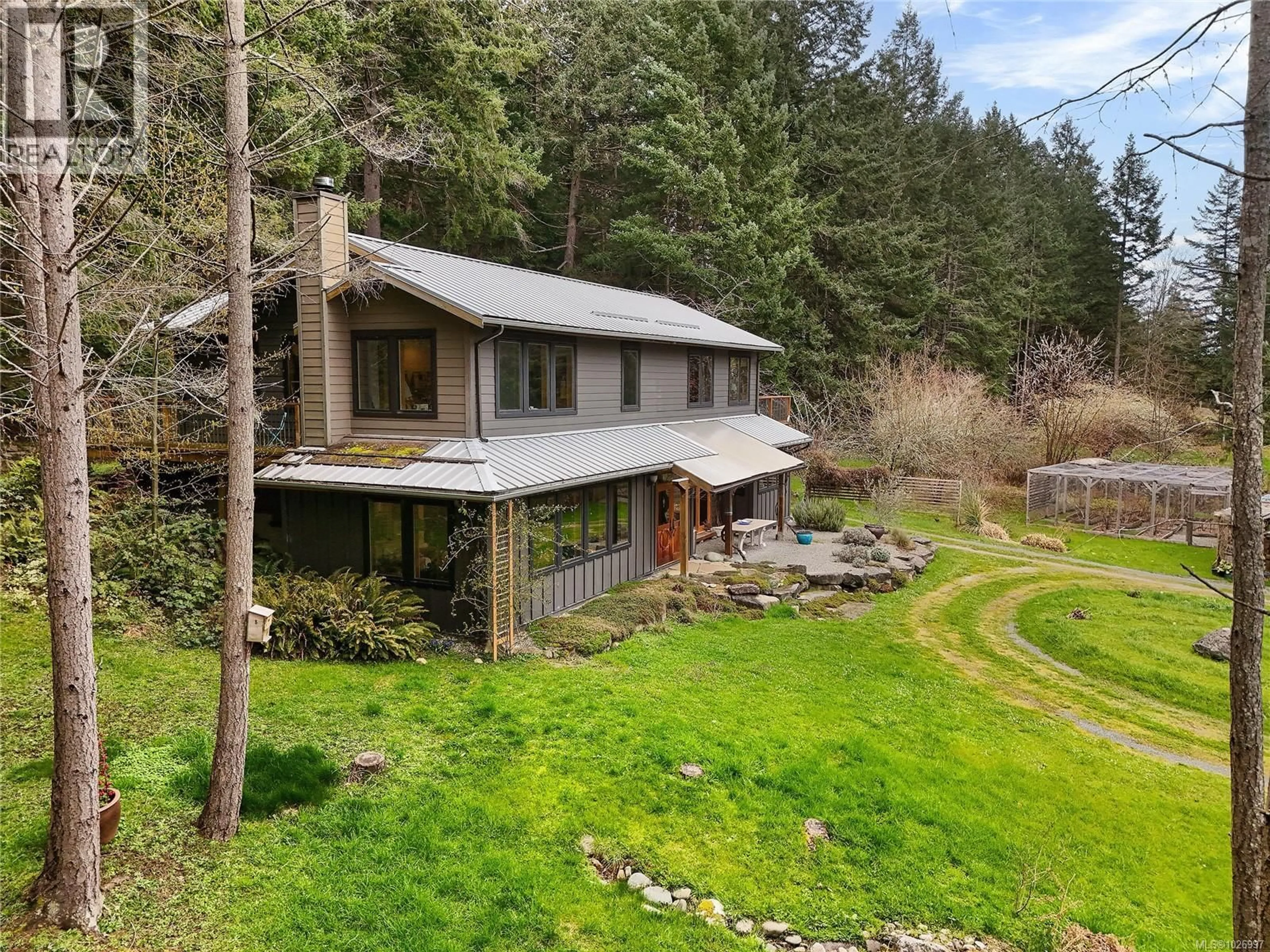 A pic from outside/outdoor area/front of a property/back of a property/a pic from drone, unknown for 594 HORTON BAY ROAD, Mayne Island British Columbia V0N2J2