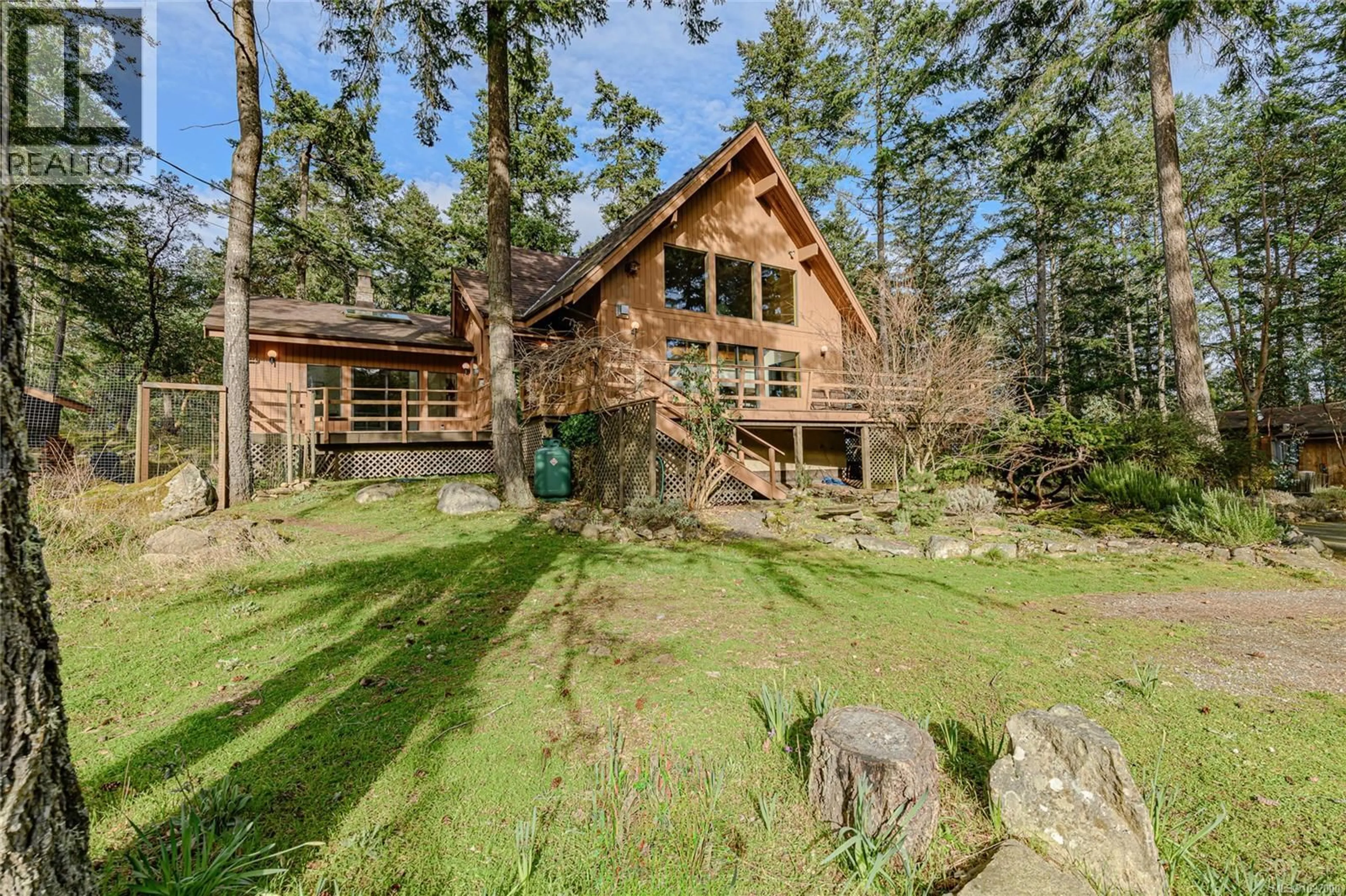 A pic from outside/outdoor area/front of a property/back of a property/a pic from drone, forest/trees view for 392 LANGS ROAD, Salt Spring British Columbia V8K1N3