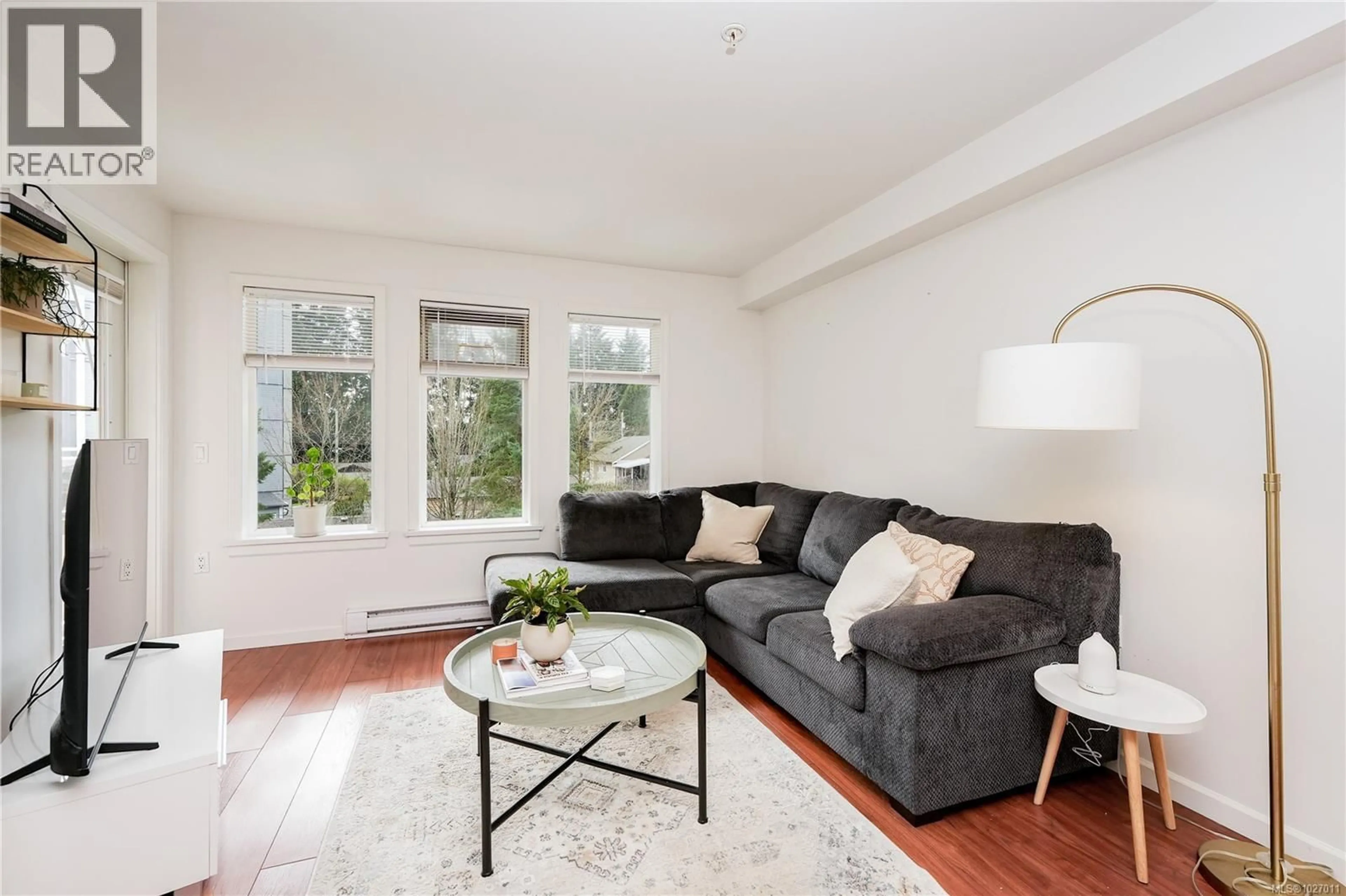 Living room with furniture, wood/laminate floor for 309 - 655 GOLDSTREAM AVENUE, Langford British Columbia V9B0G2