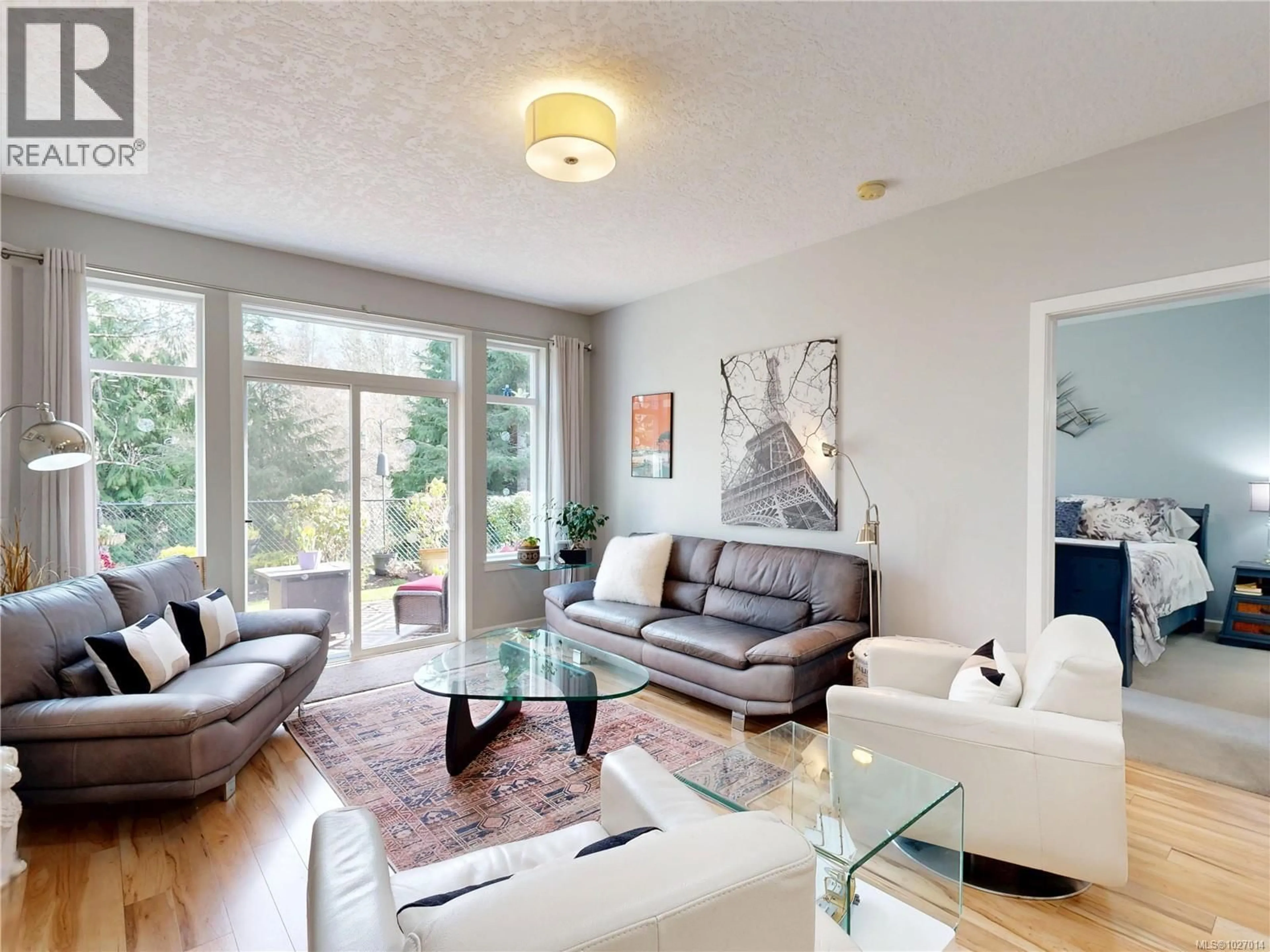 Living room with furniture, wood/laminate floor for 6357 SHAMBROOK DRIVE, Sooke British Columbia V9Z0Y4