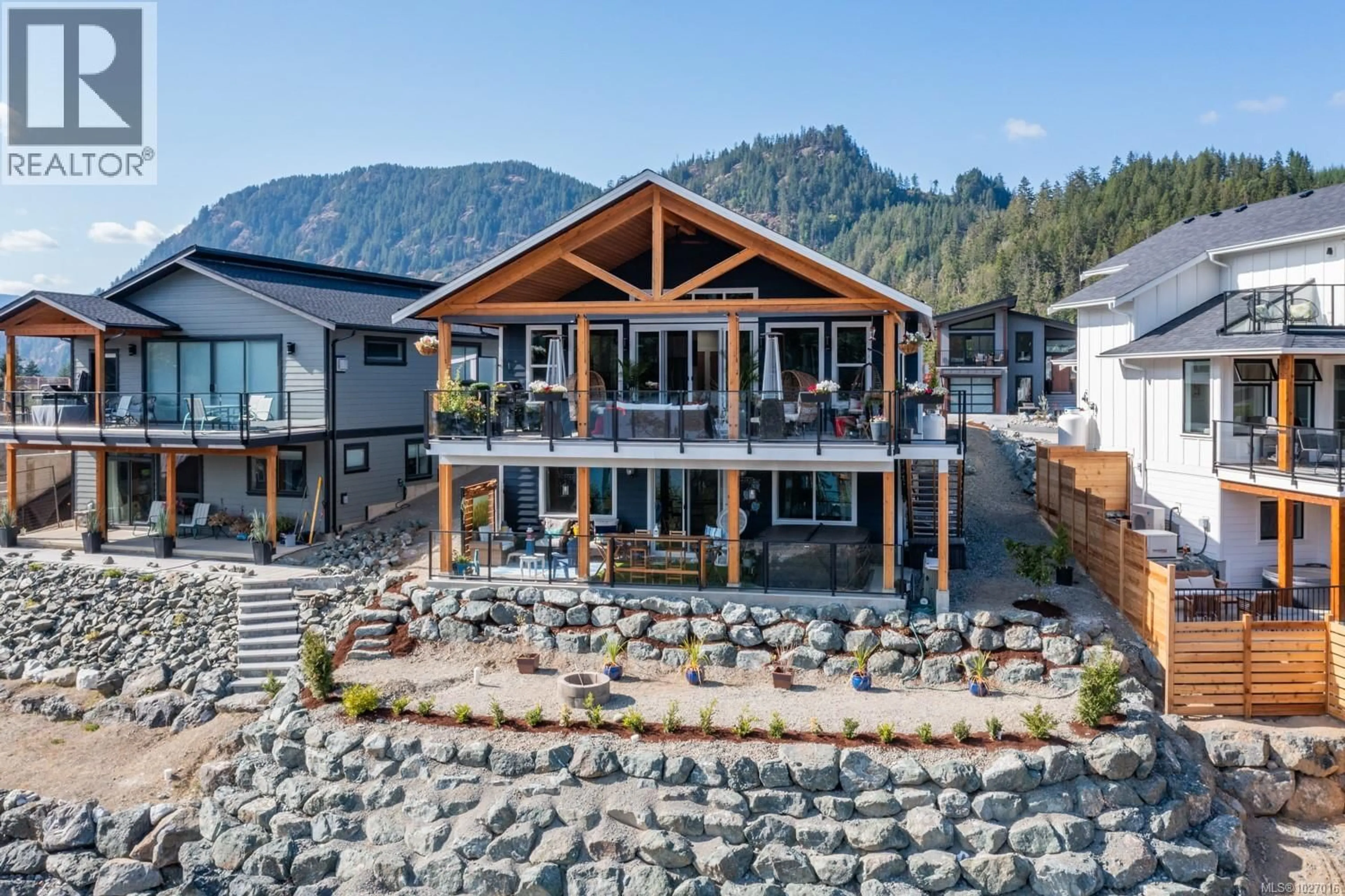 A pic from outside/outdoor area/front of a property/back of a property/a pic from drone, mountain view for 9388 LAKEFRONT RISE, Lake Cowichan British Columbia V0R2G1